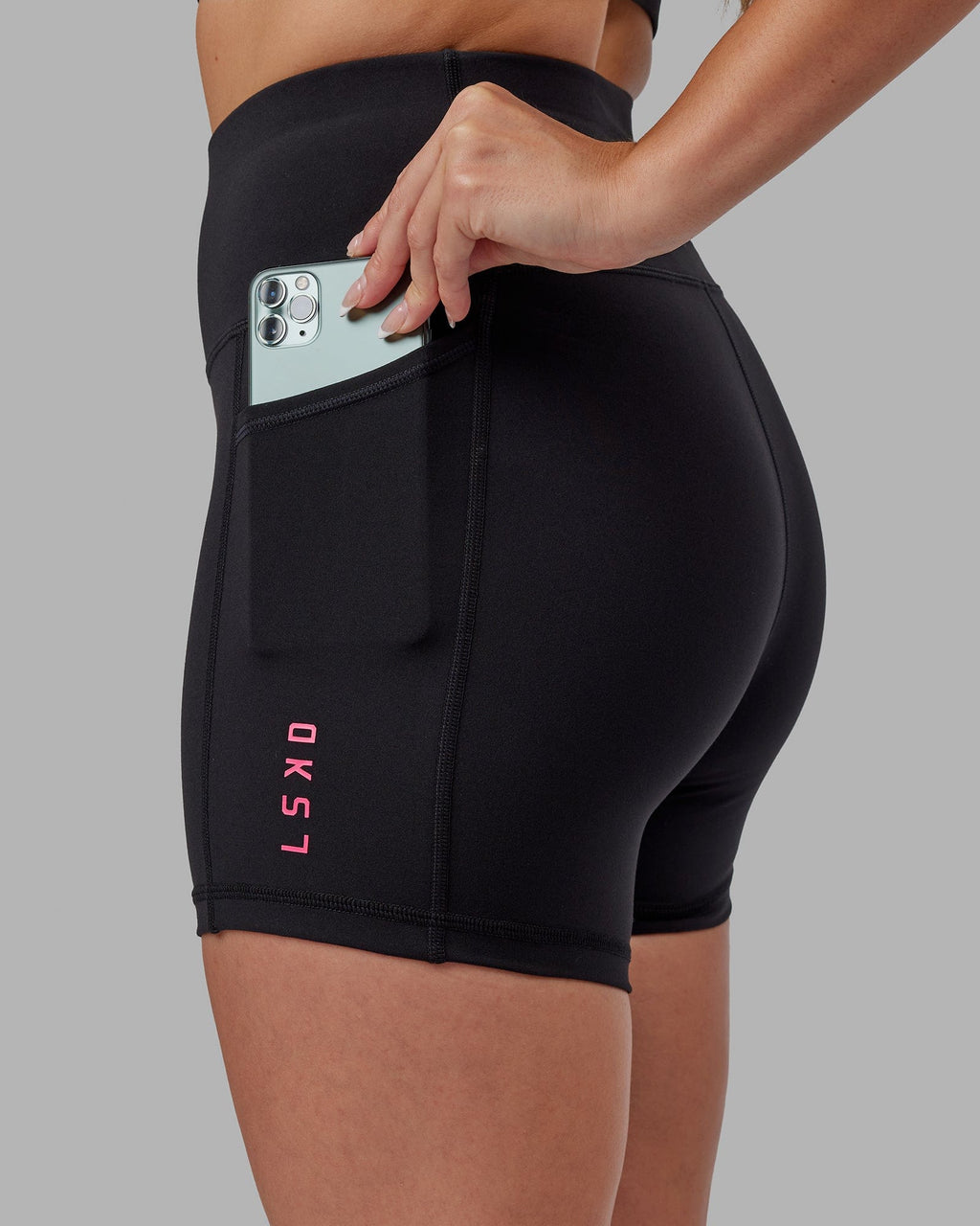 Model wearing Rep X-Short Tight - Black-Boysenberry