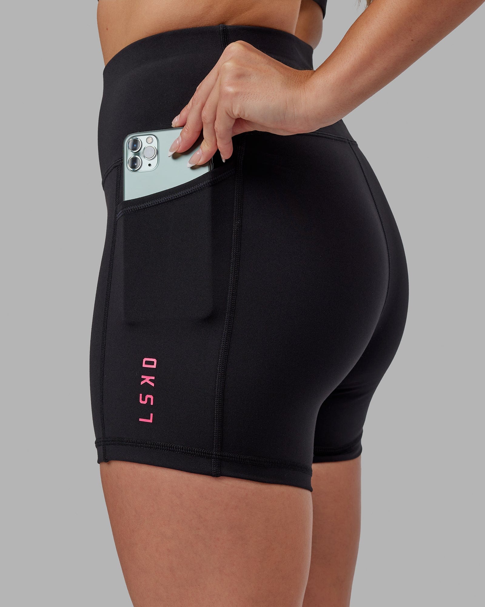 Model wearing Rep X-Short Tight - Black-Boysenberry