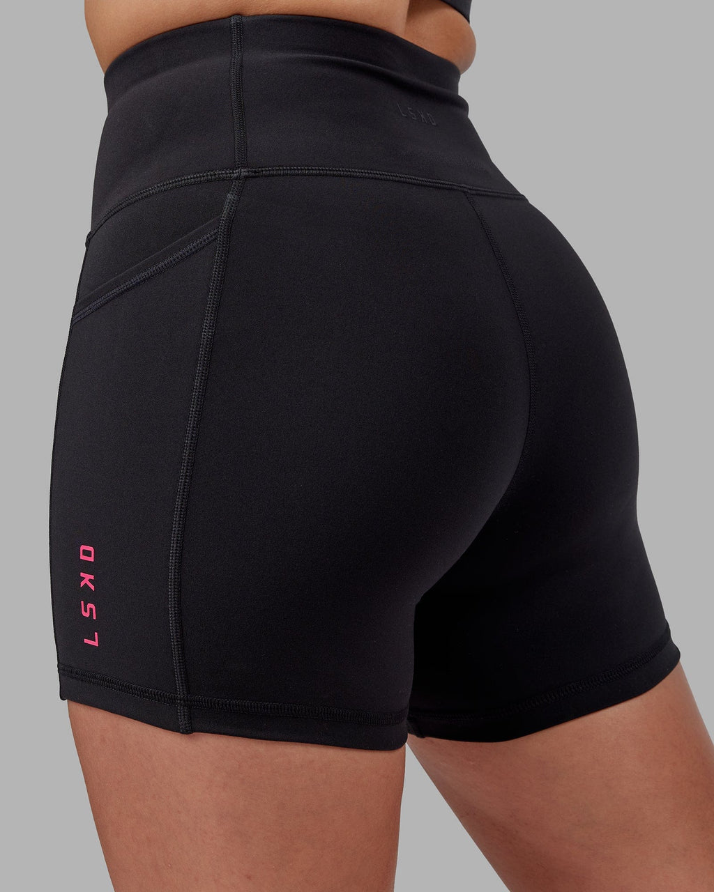 Model wearing Rep X-Short Tight - Black-Boysenberry