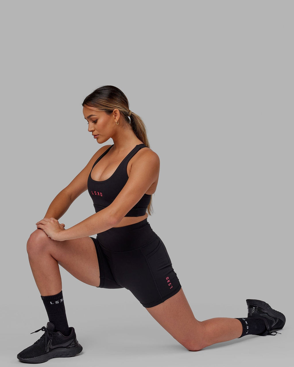 Model wearing Rep X-Short Tight - Black-Boysenberry