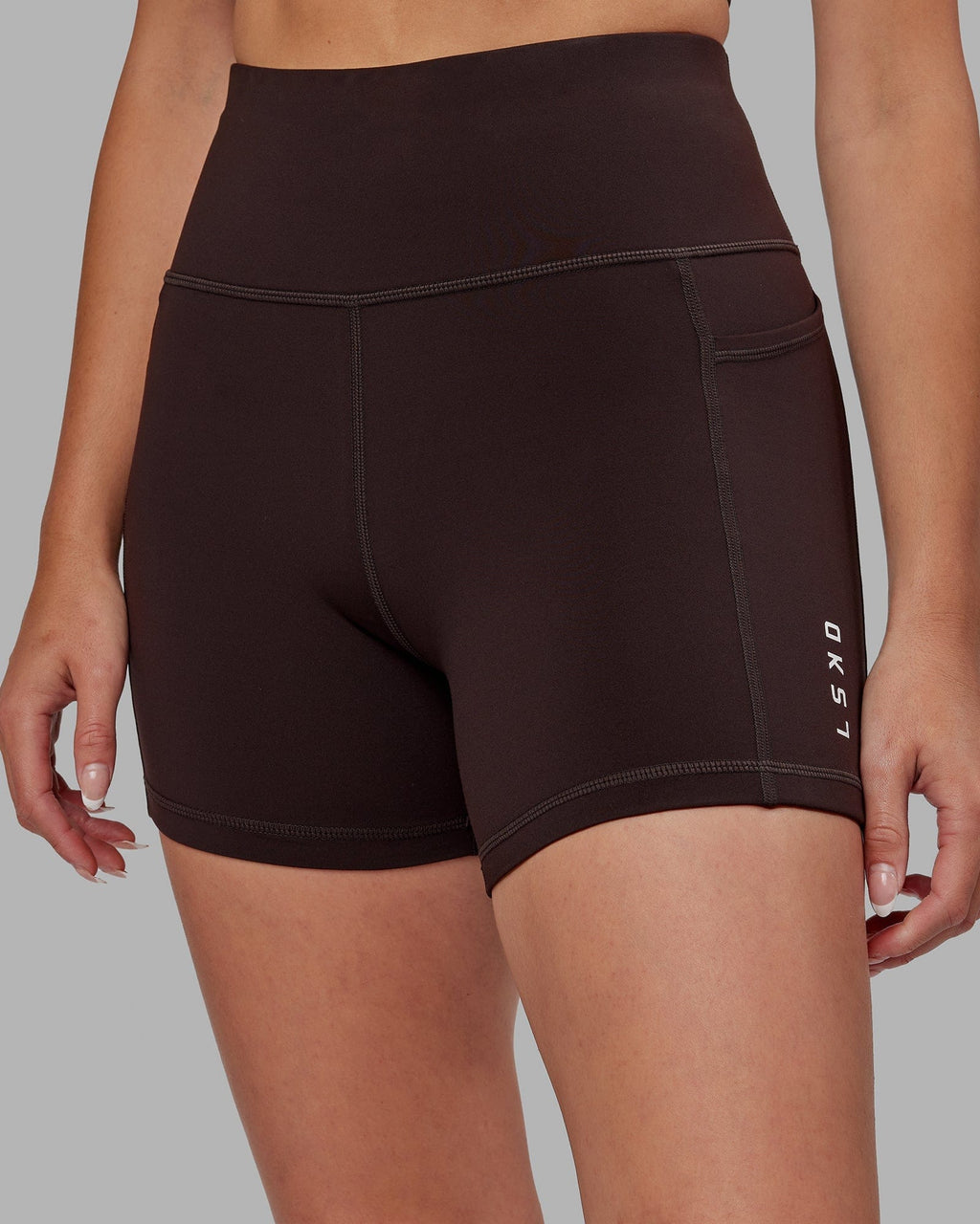 Model wearing Rep X-Short Tight - Dark Walnut