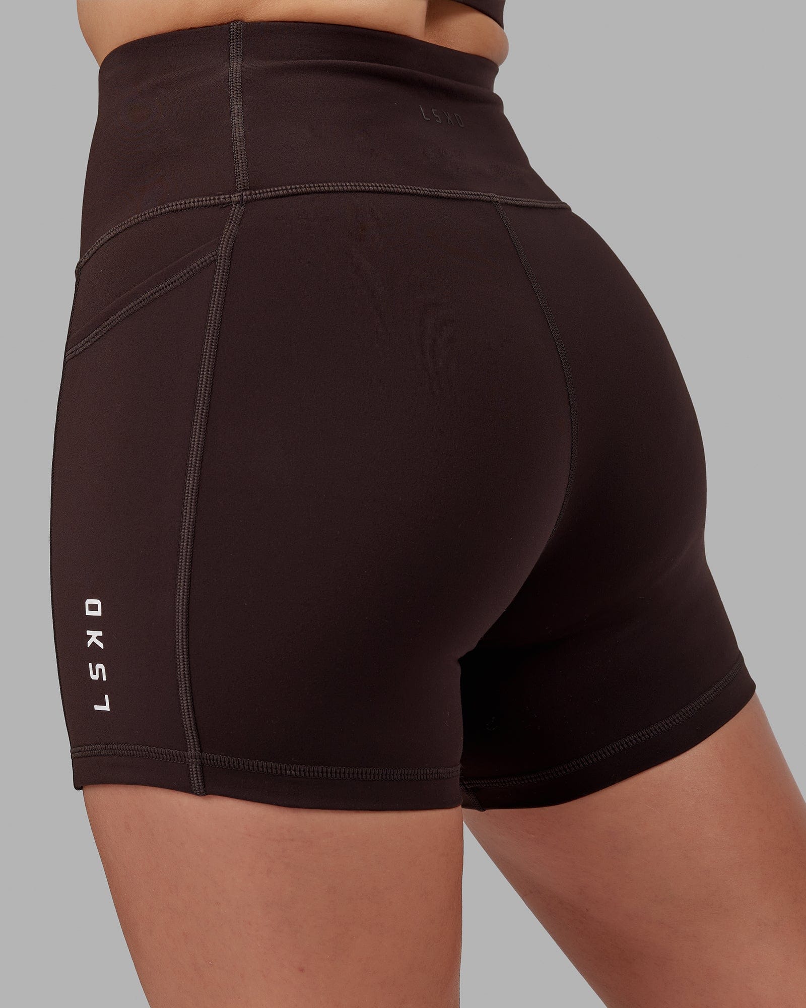 Model wearing Rep X-Short Tight - Dark Walnut