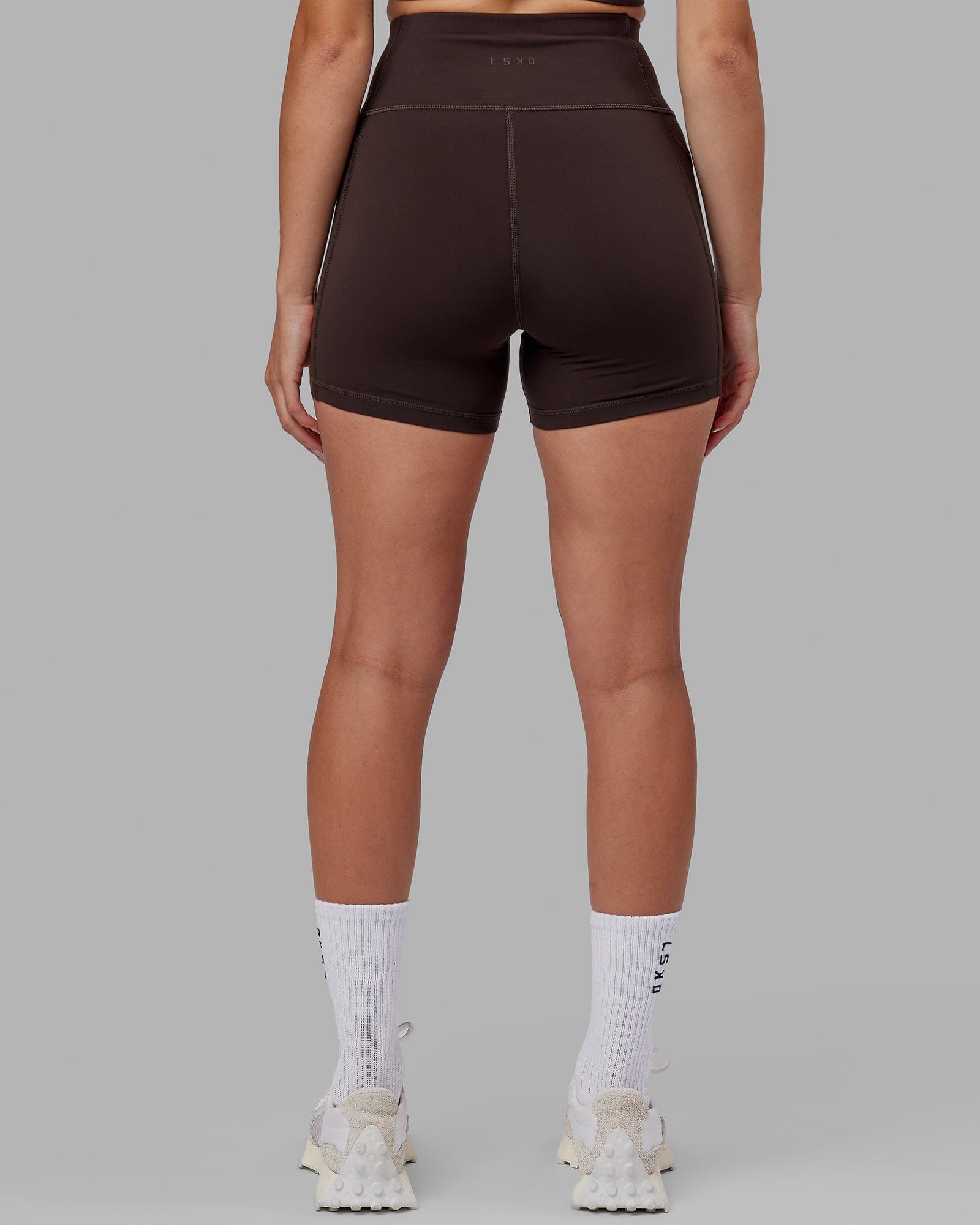 Model wearing Rep X-Short Tight - Dark Walnut