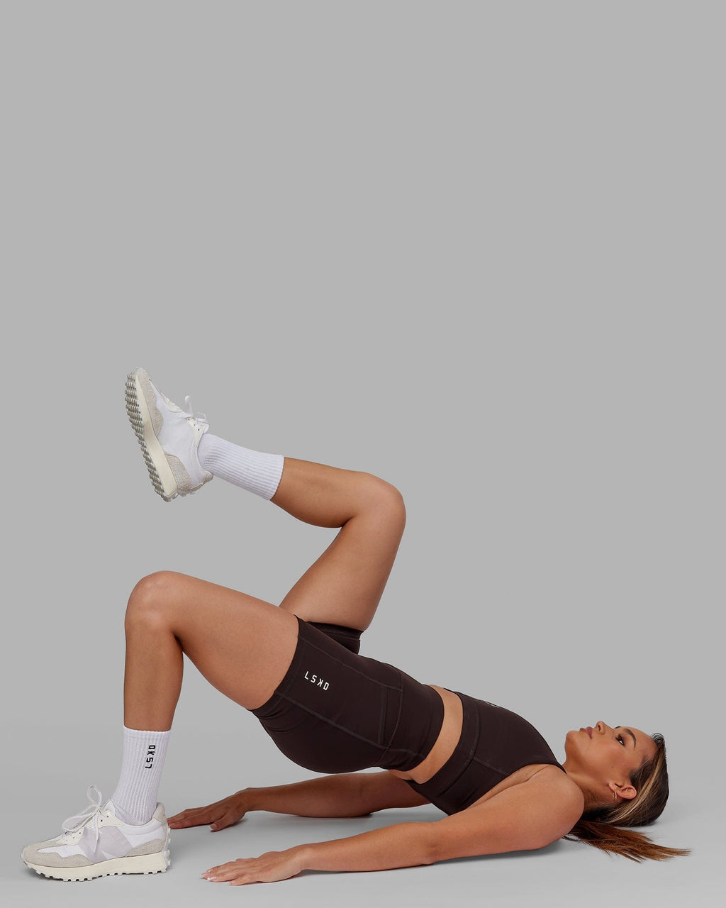 Model wearing Rep X-Short Tight - Dark Walnut