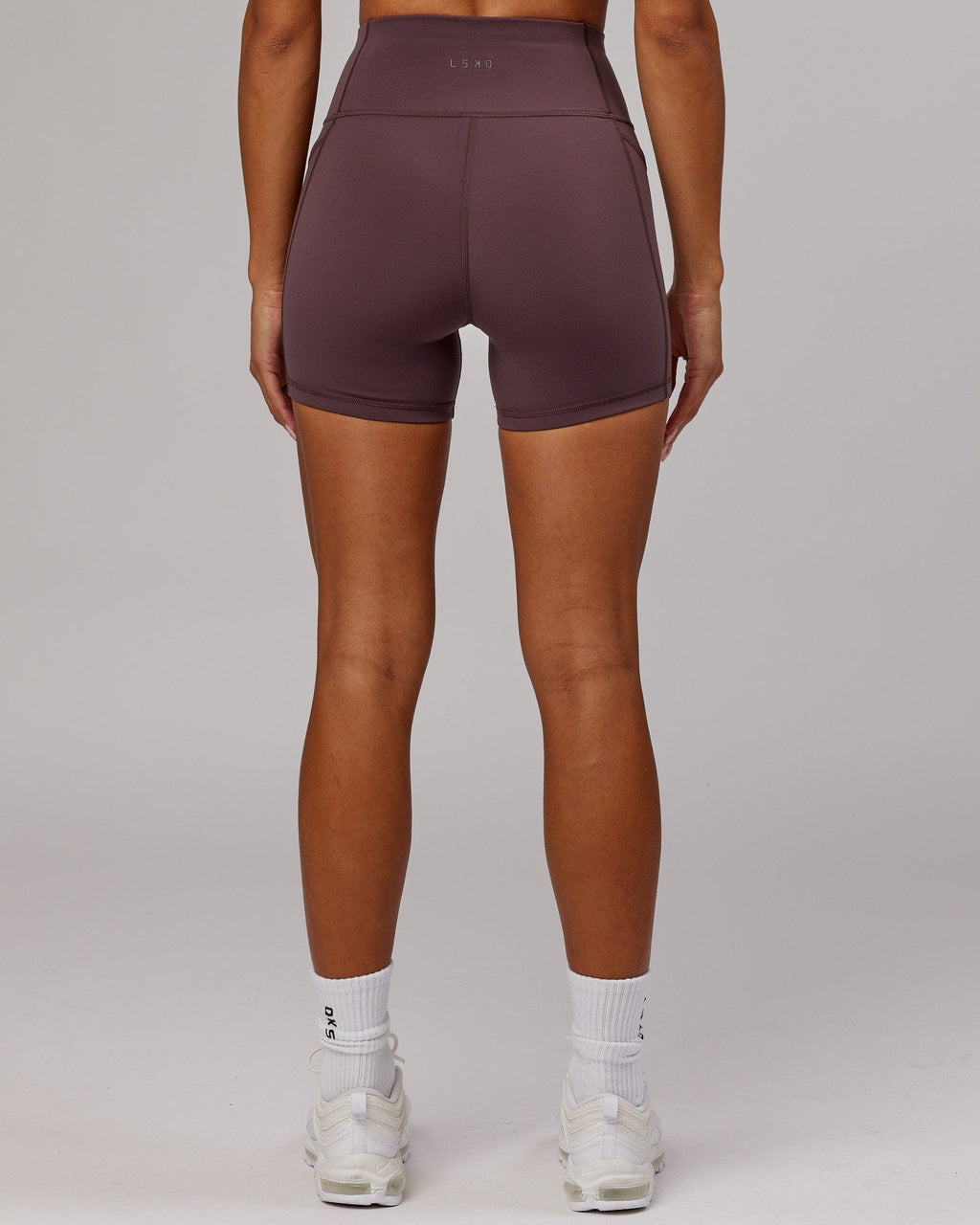 Model wearing Rep X-Short Tight - Plum