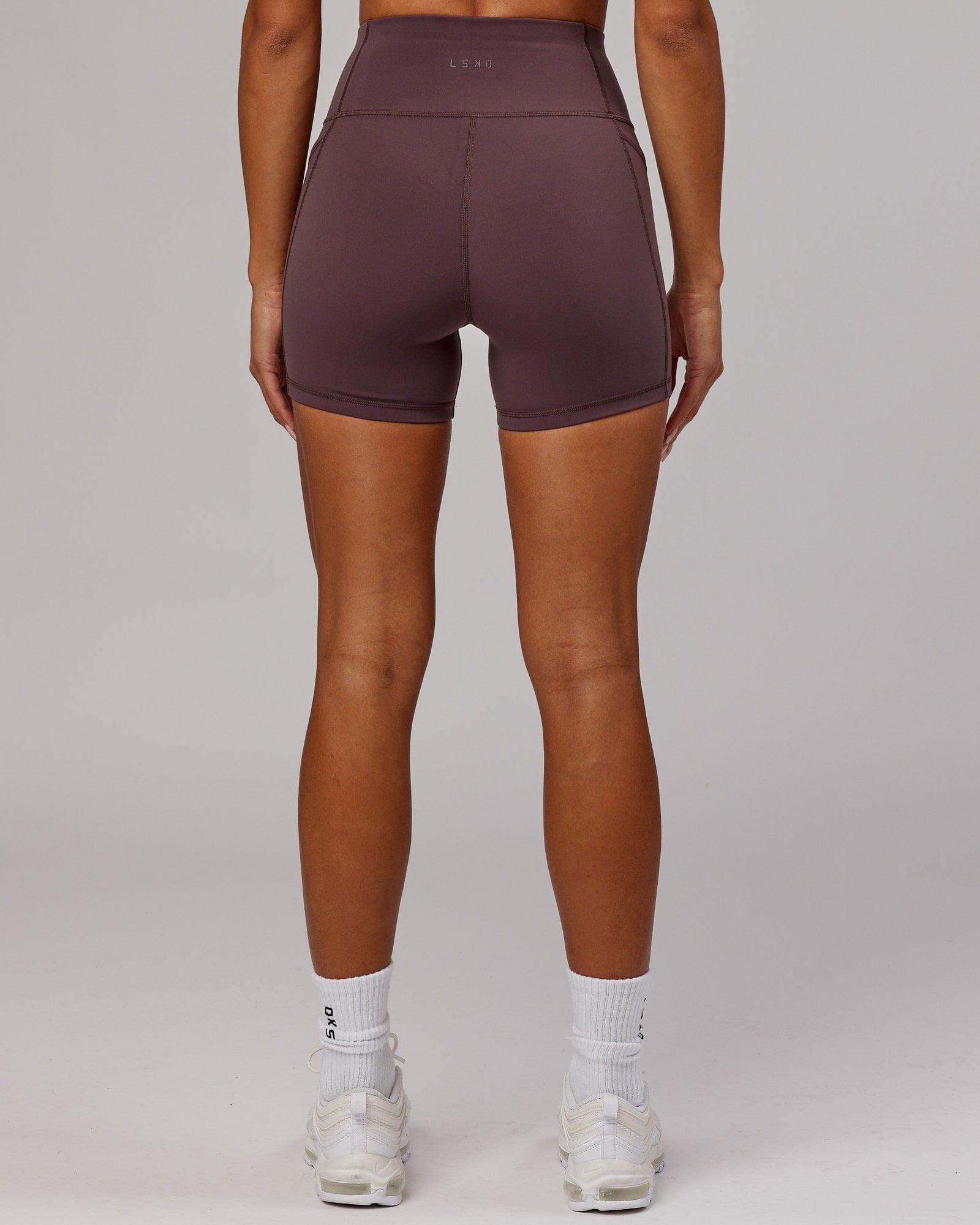 Model wearing Rep X-Short Tight - Plum