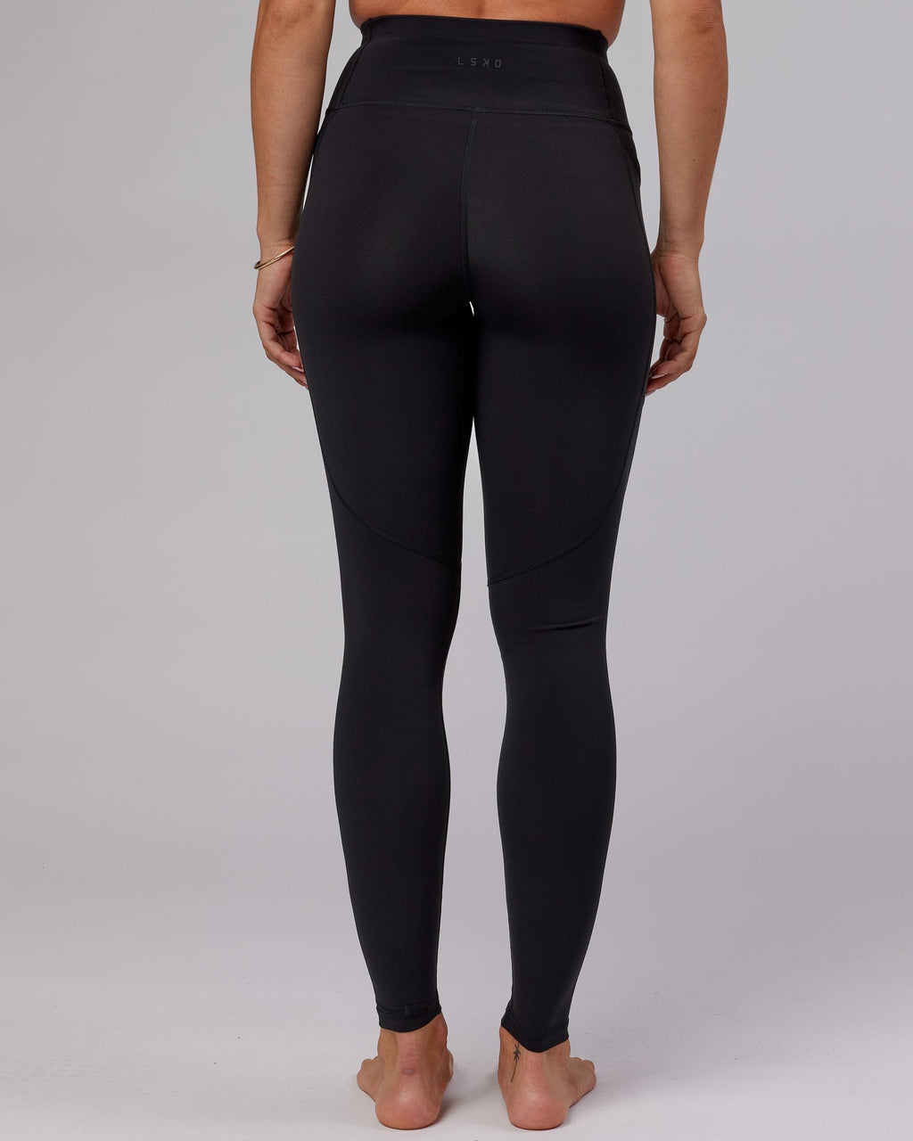 Model wearing Rep X-Long Tight - Black-Boysenberry