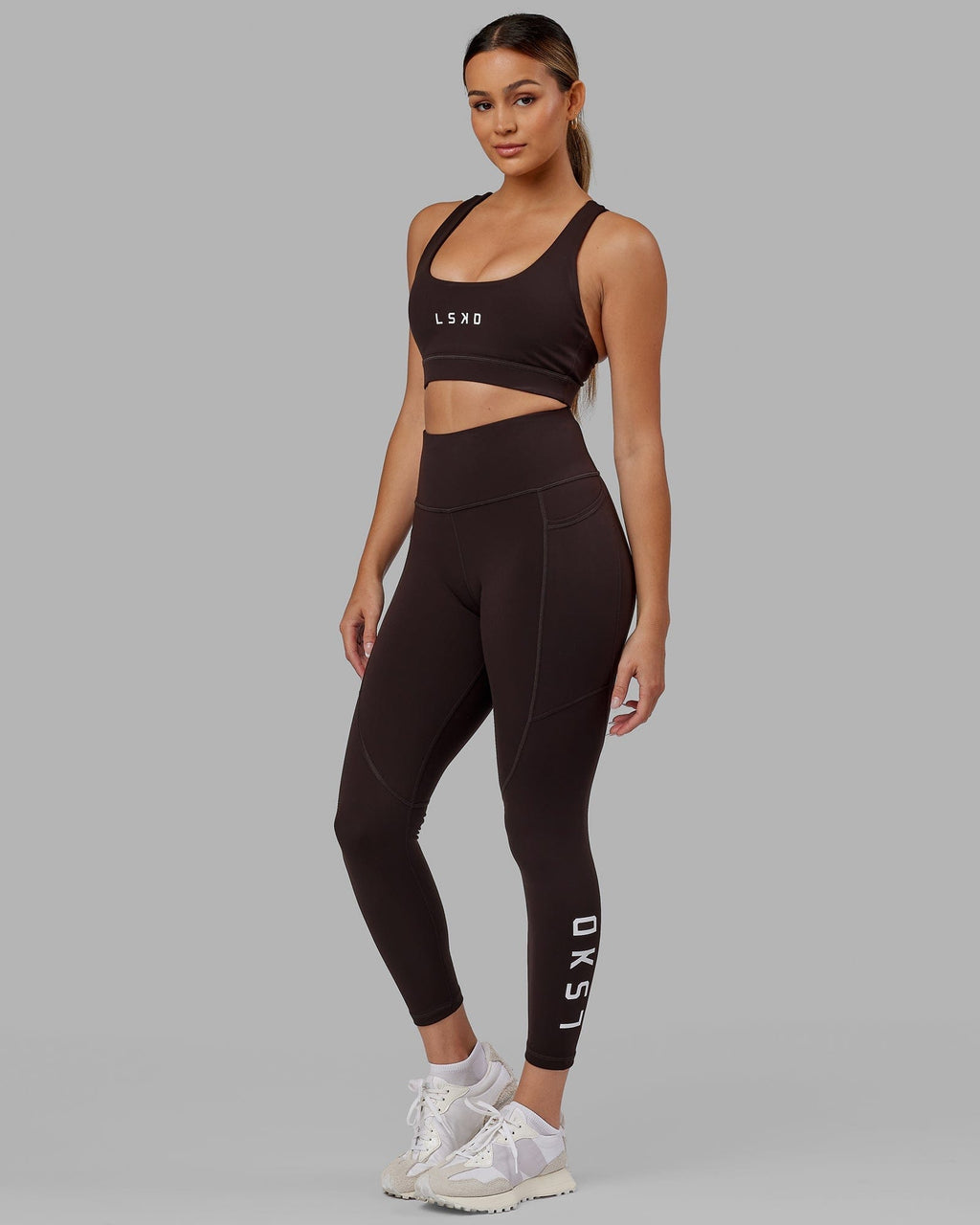 Model wearing Rep 7/8 Length Tight - Dark Walnut