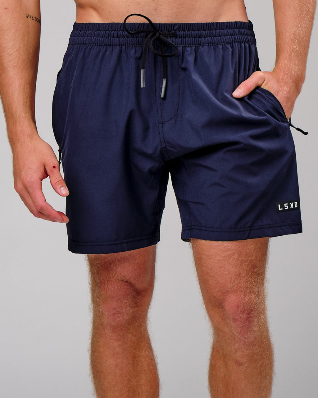 Model wearing Rep 7" Performance Short - Navy