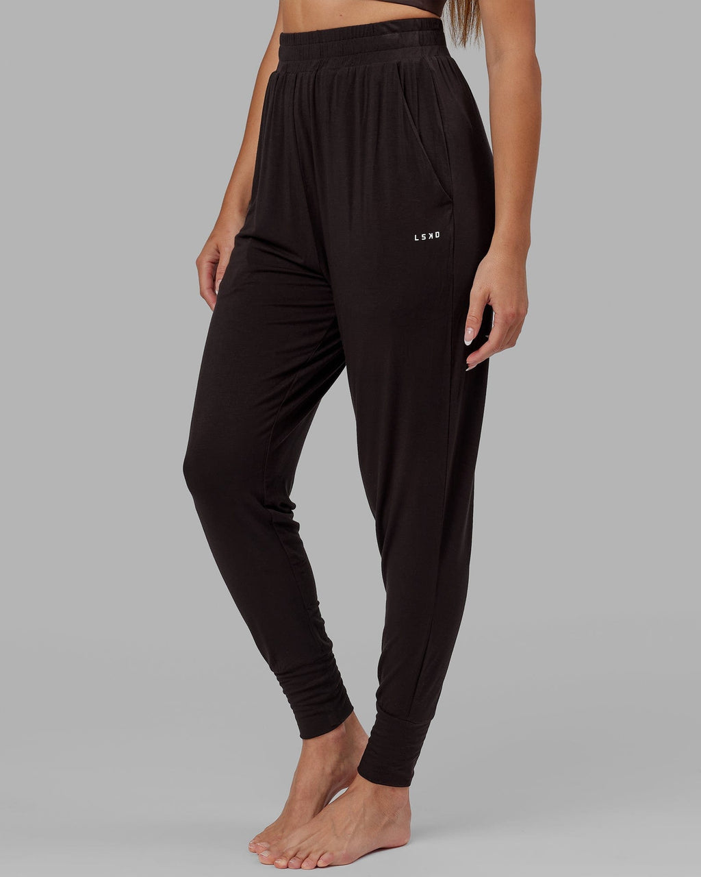 Model wearing Rest and Recover Pant - Dark Walnut