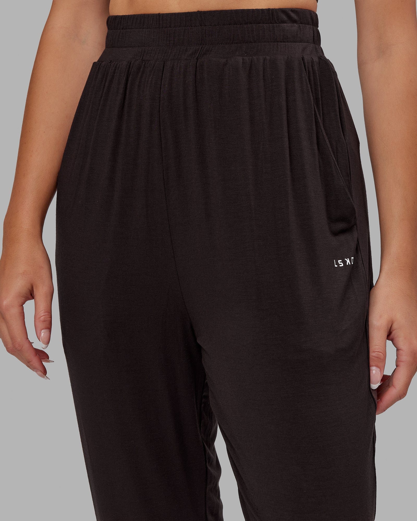 Model wearing Rest and Recover Pant - Dark Walnut