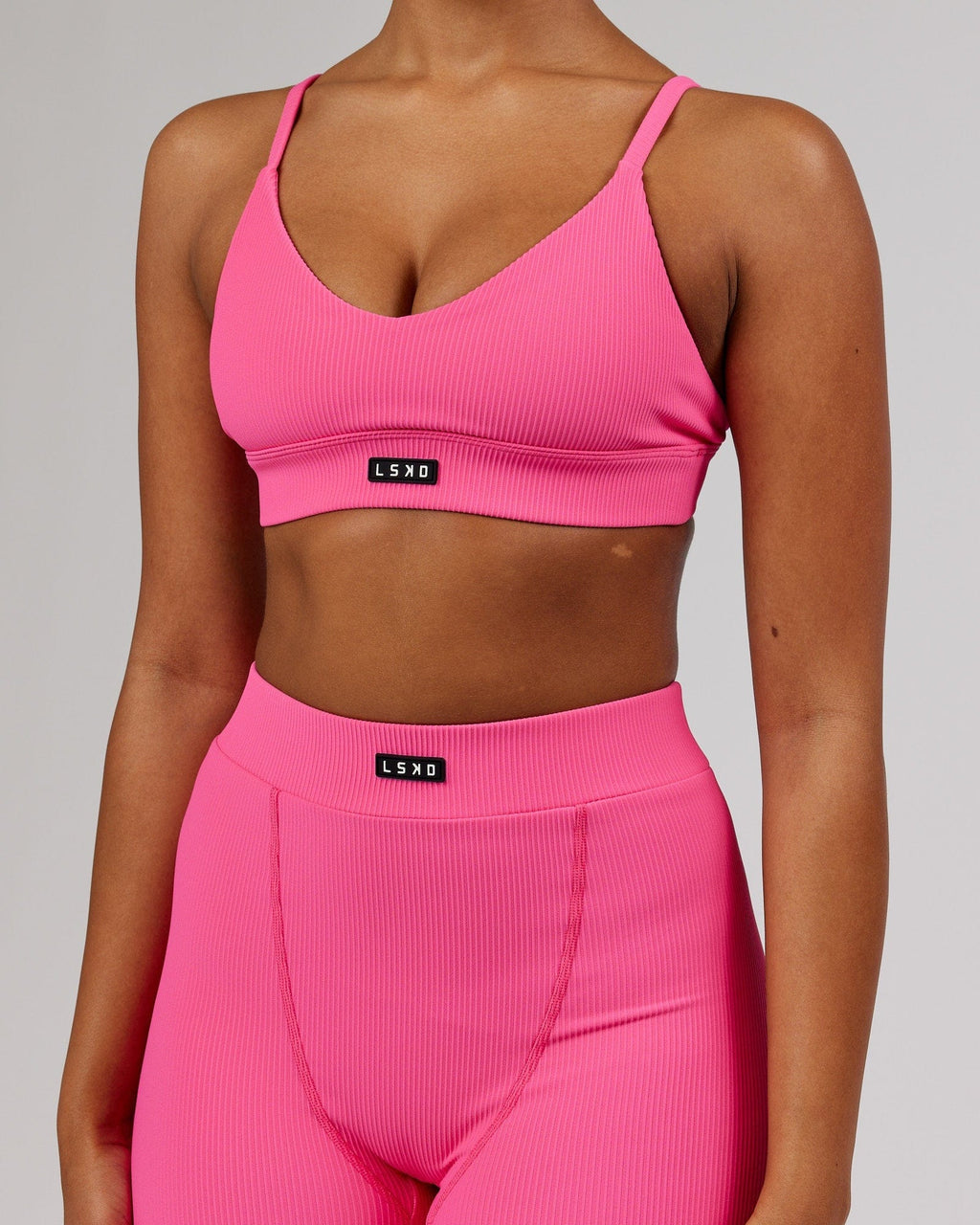 Model wearing Vitalize Ribbed Bralette - Flamingo