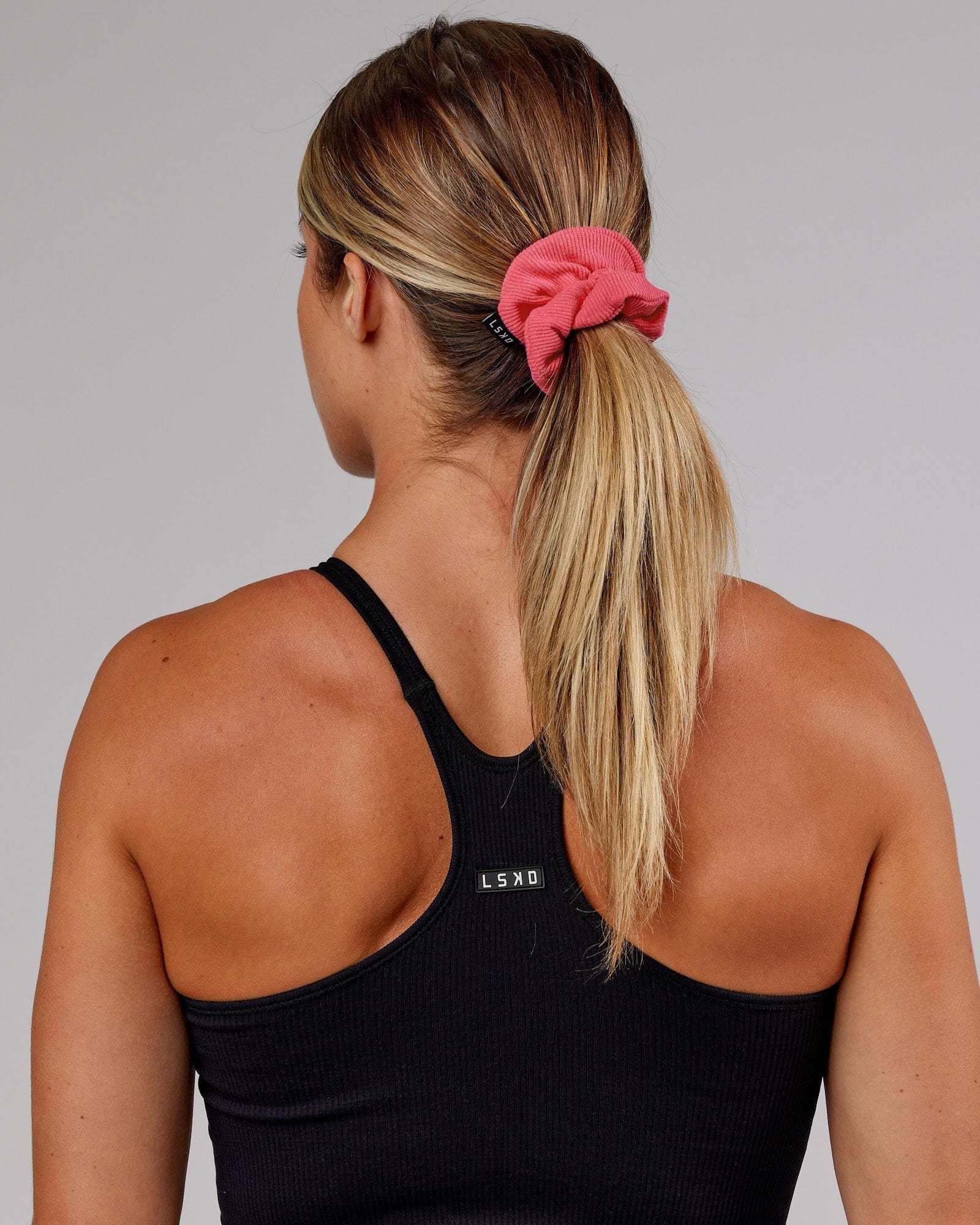 Model wearing Ribbed Scrunchie - Coral