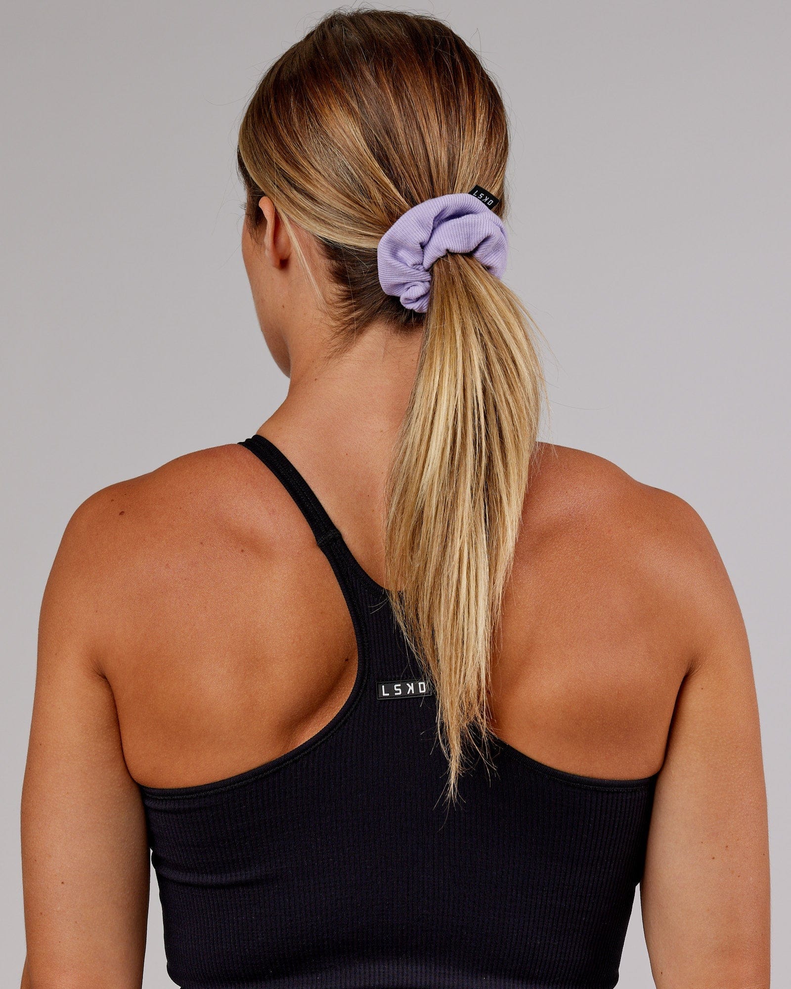 Model wearing Ribbed Scrunchie - Pale Lilac