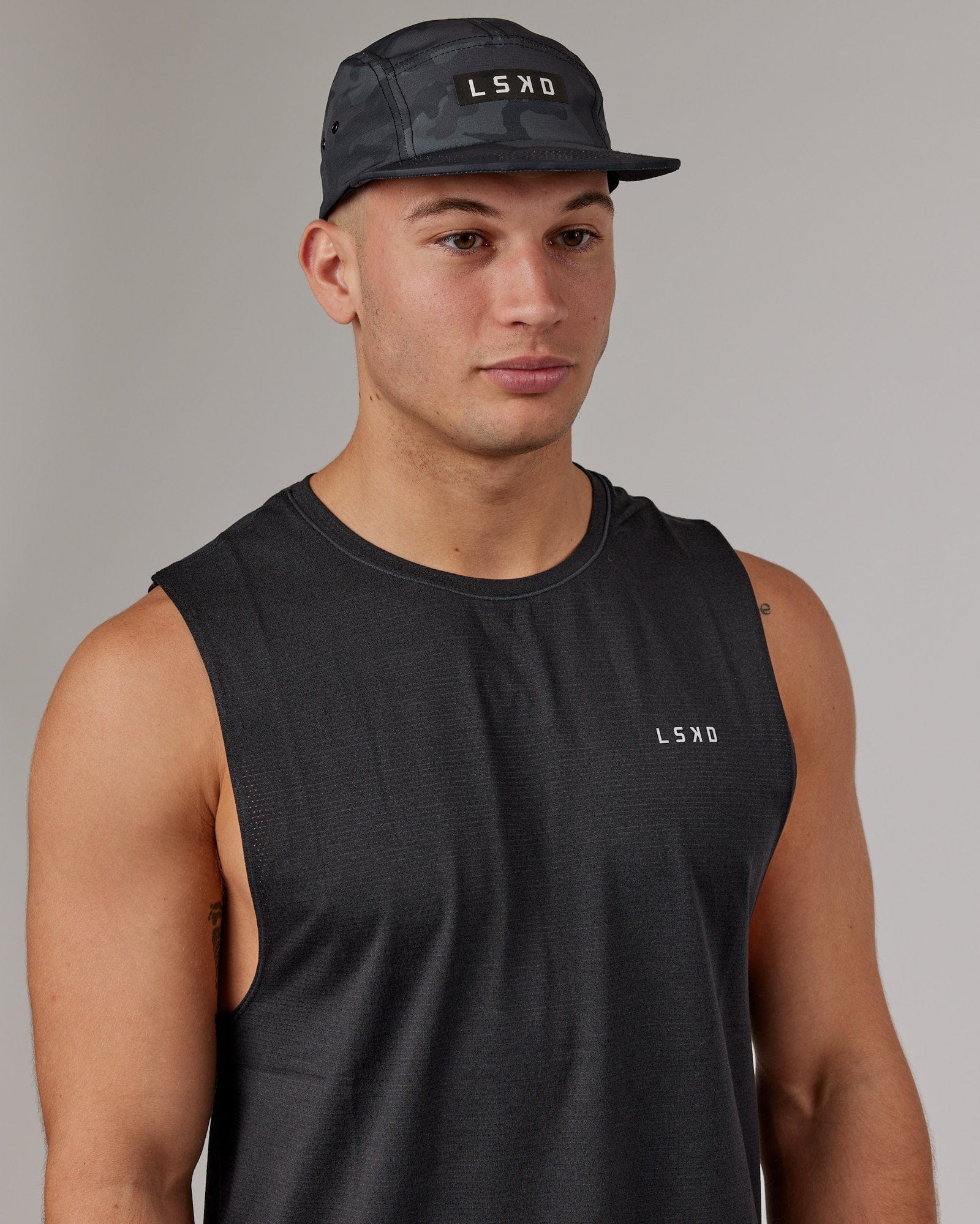 Model wearing Run Club Cap - Camo