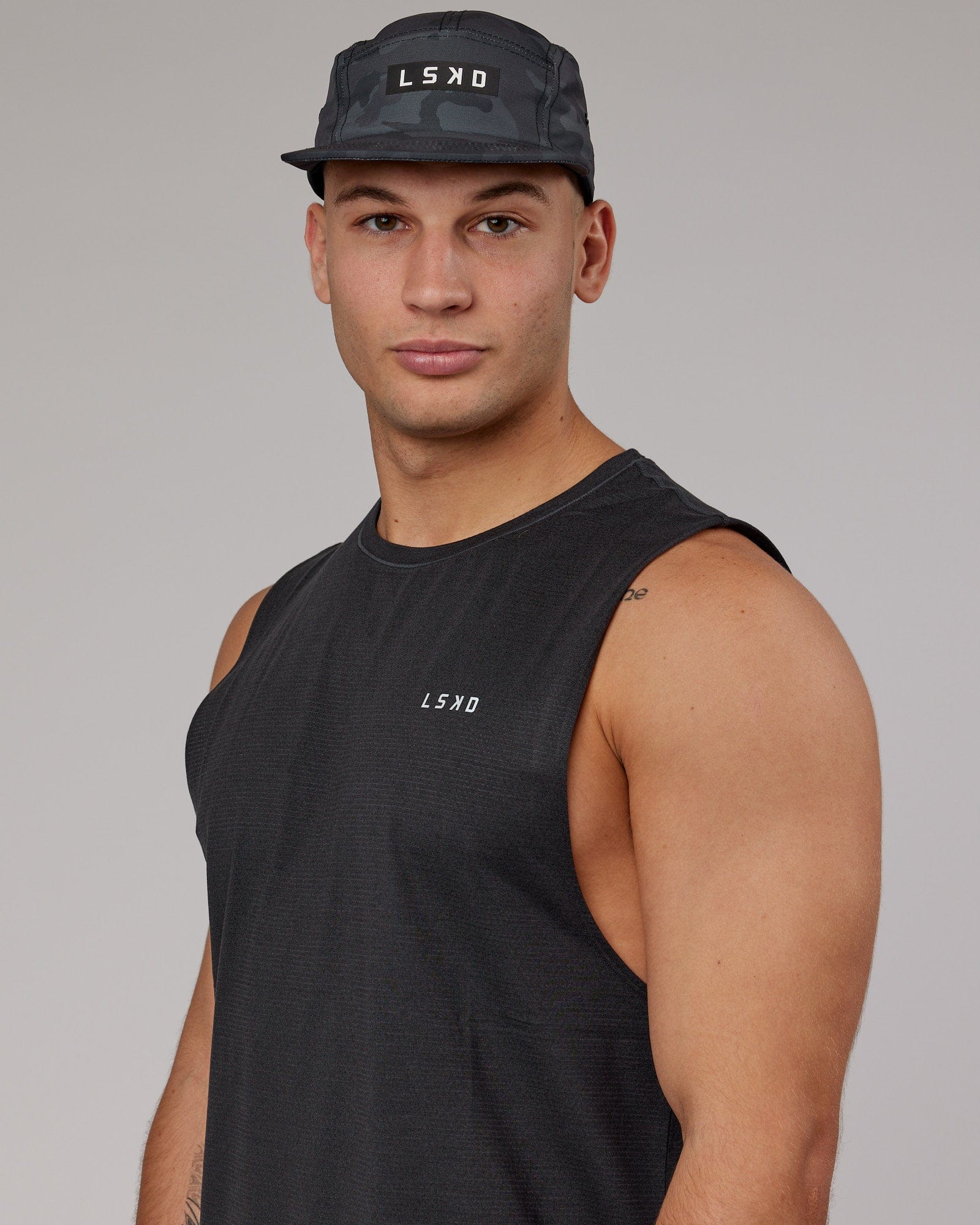 Model wearing Run Club Cap - Camo