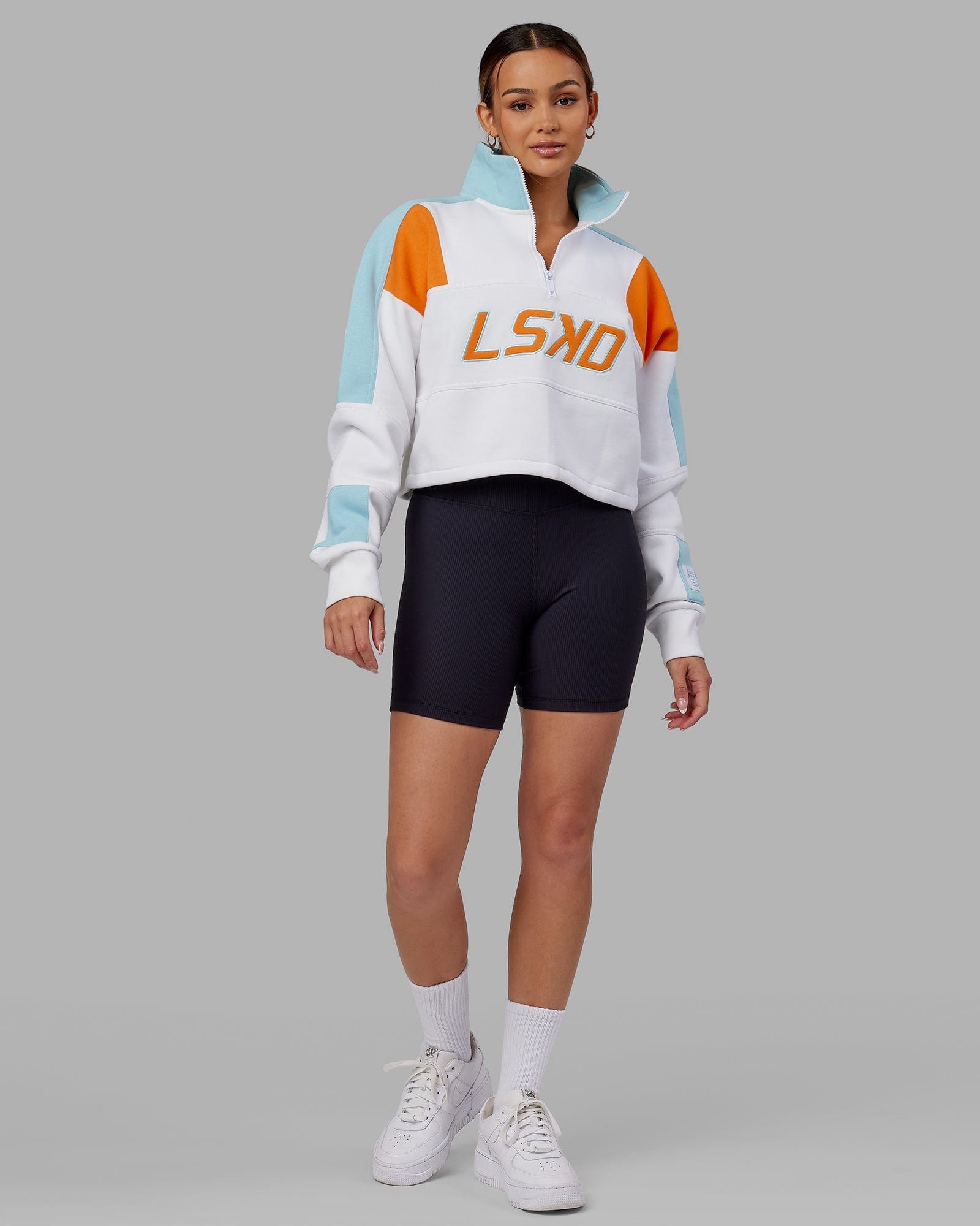 Model wearing Slam 1/4 Zip Sweater - Crystal Blue-Orange