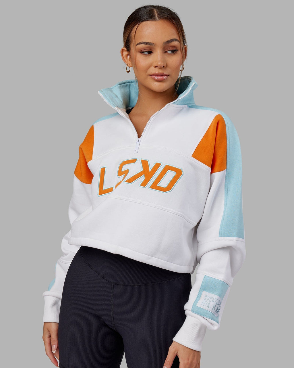 Model wearing Slam 1/4 Zip Sweater - Crystal Blue-Orange
