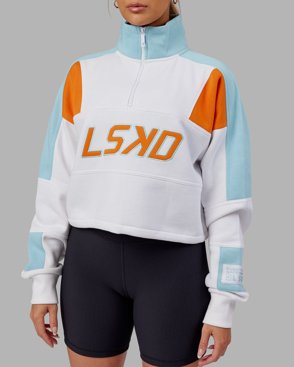 Model wearing Slam 1/4 Zip Sweater - Crystal Blue-Orange