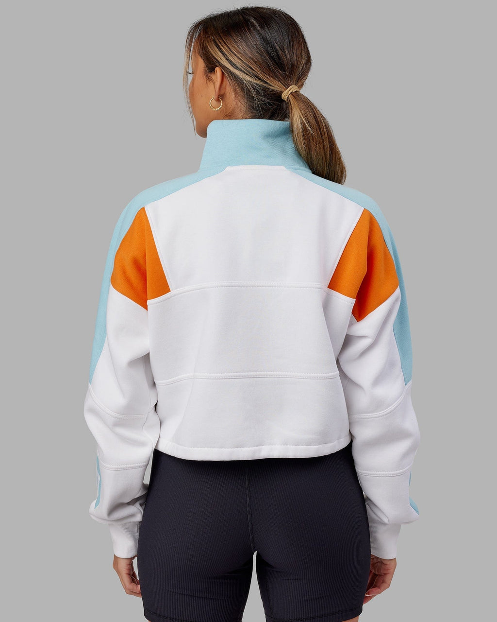 Model wearing Slam 1/4 Zip Sweater - Crystal Blue-Orange