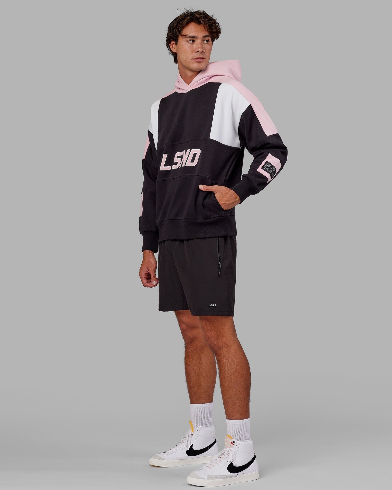 Model wearing Slam Hoodie Oversize - Black-Petal Pink