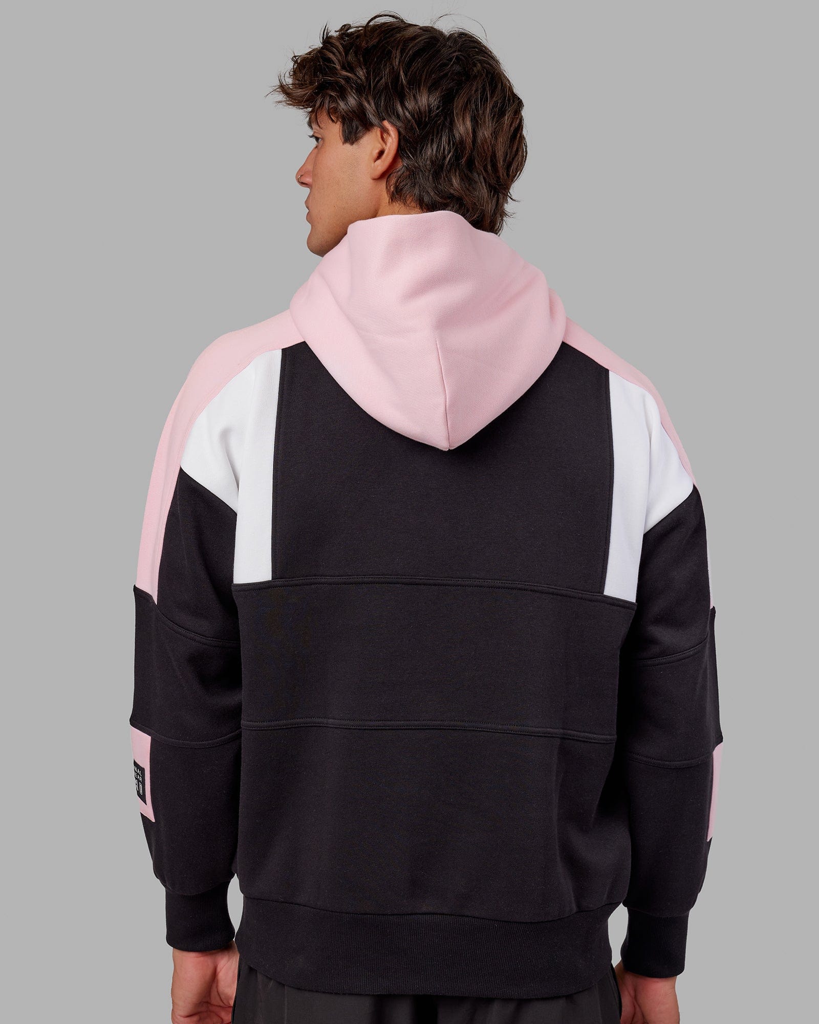 Model wearing Slam Hoodie Oversize - Black-Petal Pink