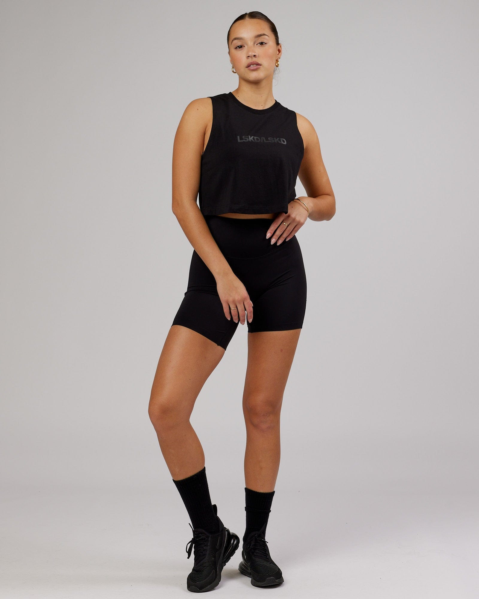 Model wearing Speedway FLXCotton Cropped Tank - Black