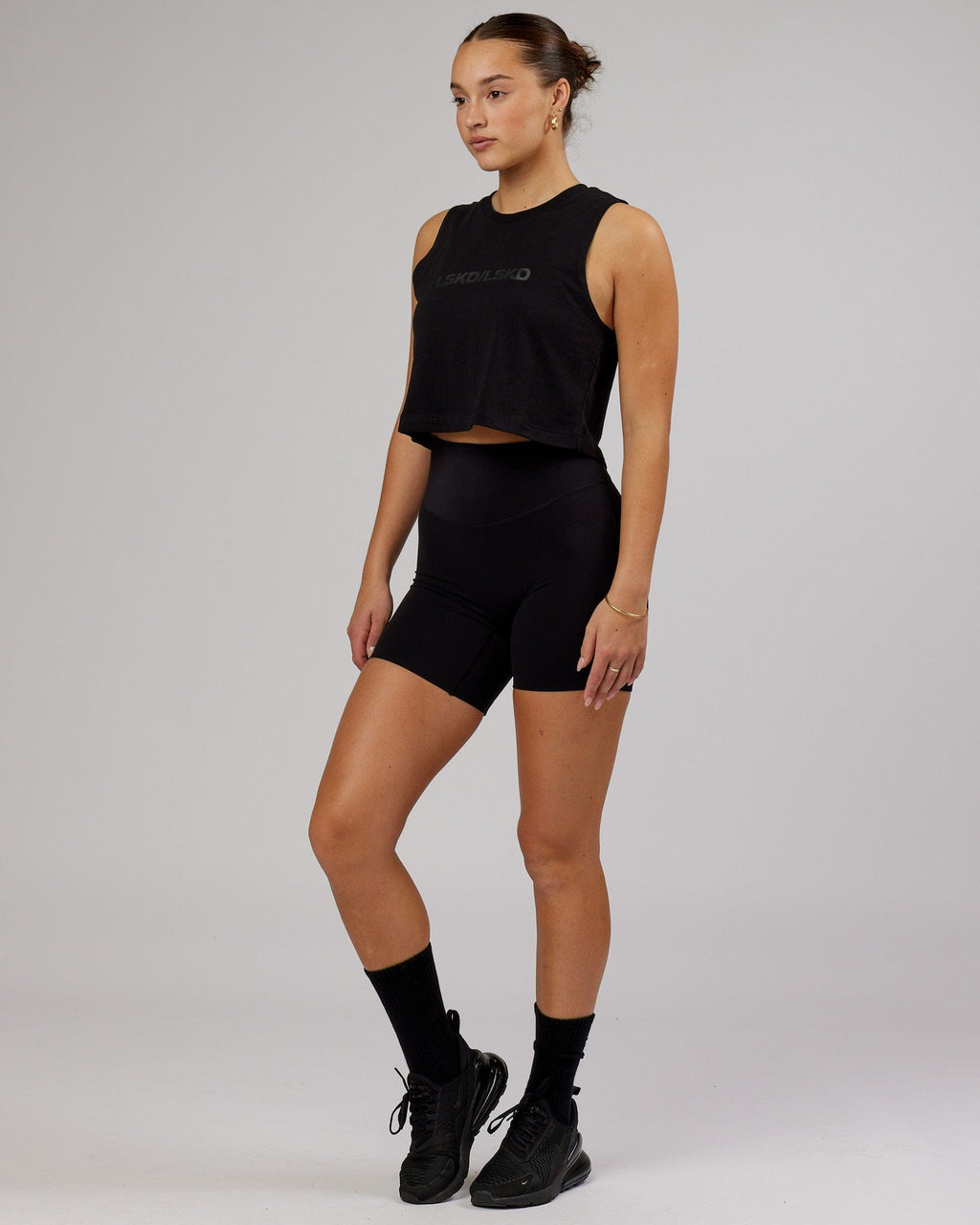 Model wearing Speedway FLXCotton Cropped Tank - Black