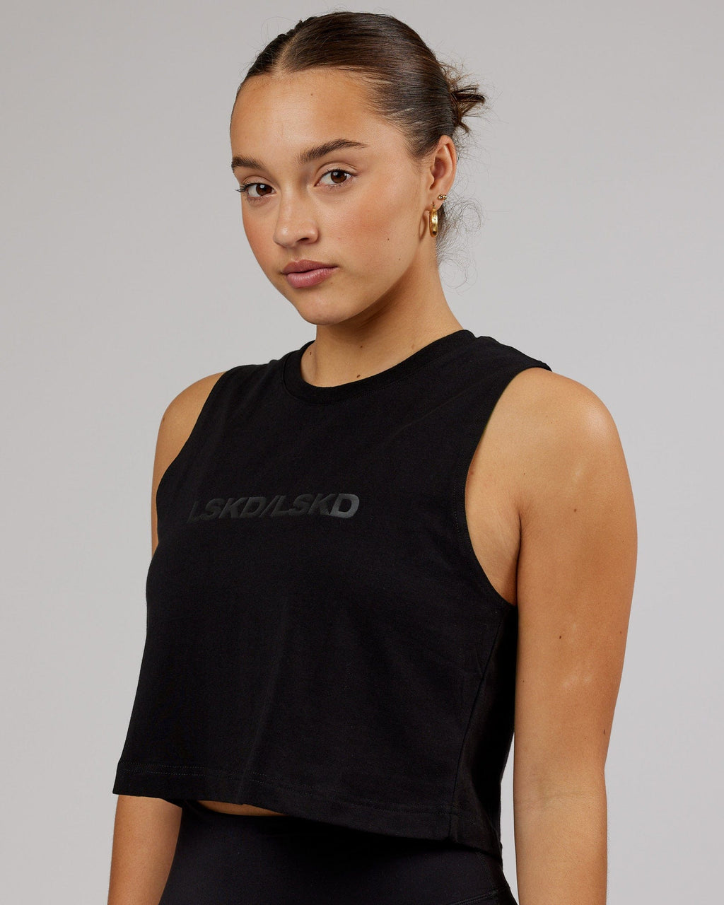 Model wearing Speedway FLXCotton Cropped Tank - Black