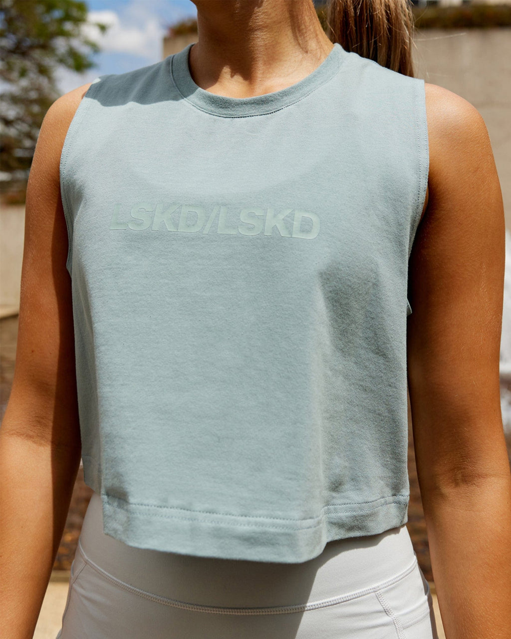 Model wearing Speedway FLXCotton Cropped Tank - Frost