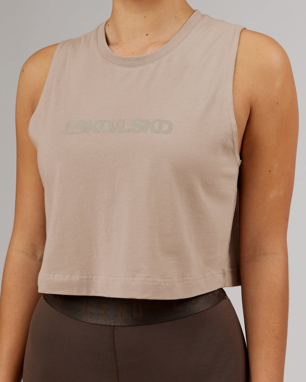 Model wearing Speedway FLXCotton Cropped Tank - Taupe