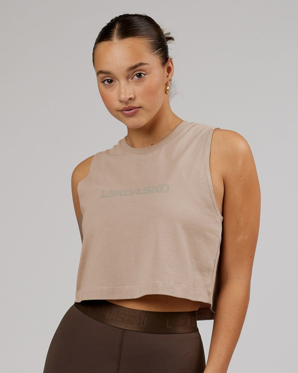 Model wearing Speedway FLXCotton Cropped Tank - Taupe