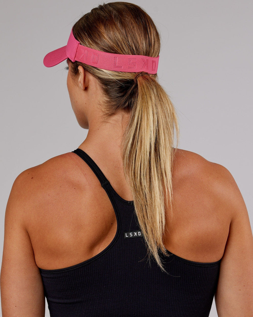Model wearing Sprint Performance Visor - Flamingo