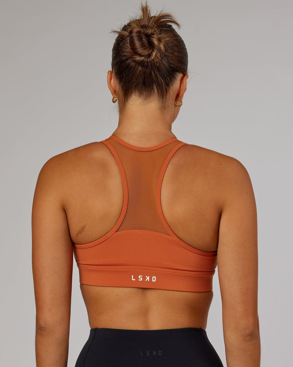 Model wearing Sprint Sports Bra - Auburn
