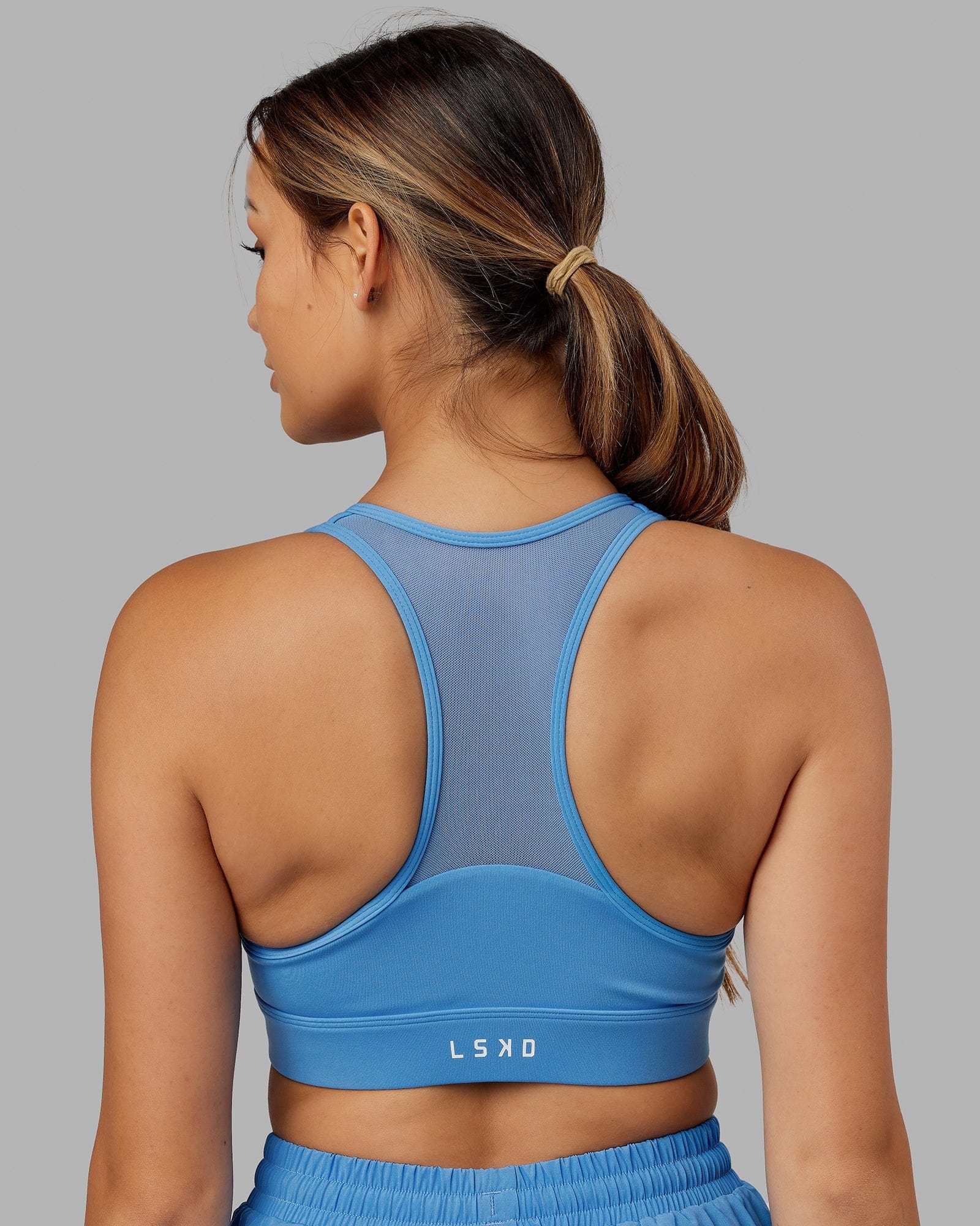 Model wearing Sprint Sports Bra - Azure Blue
