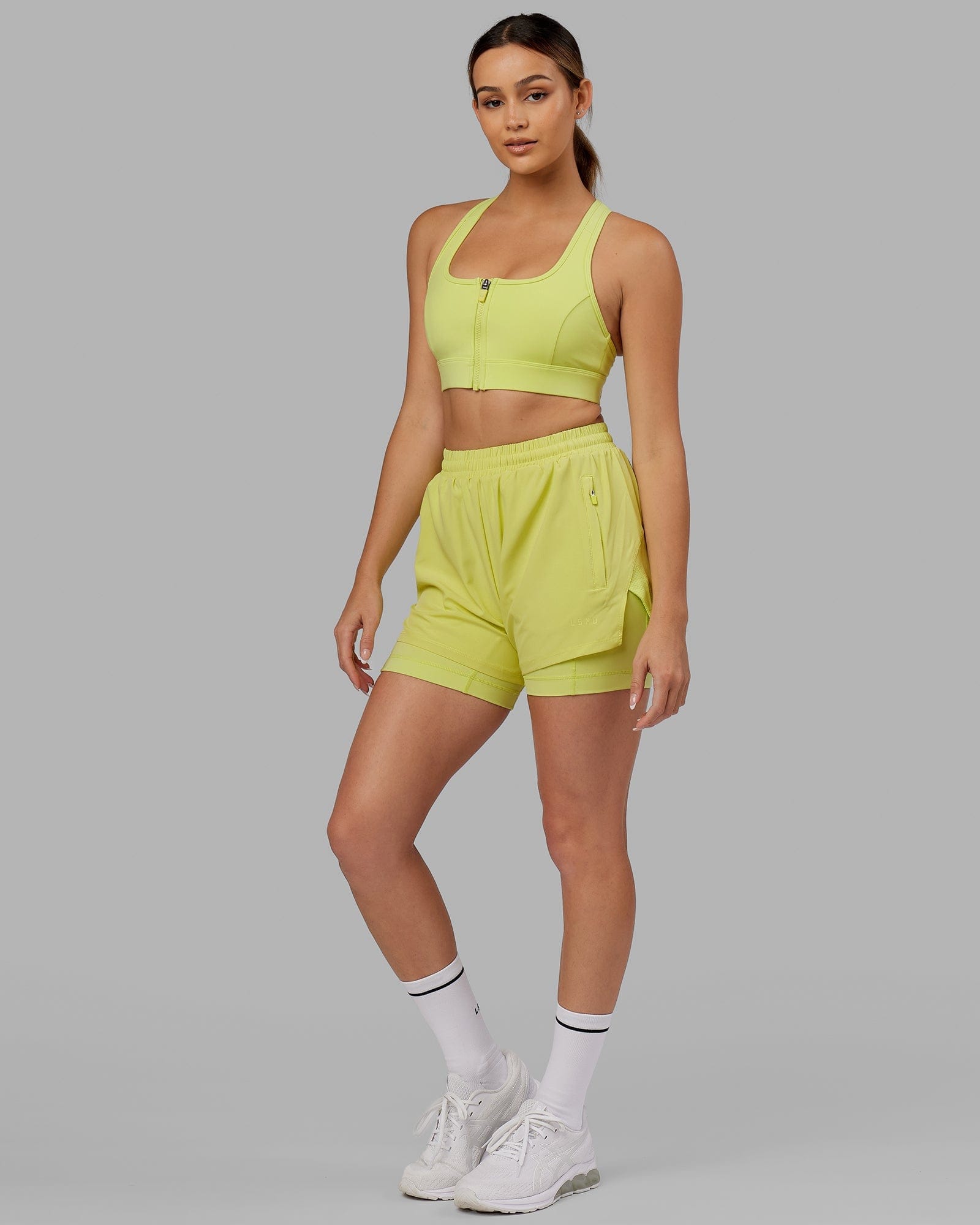 Model wearing Sprint Sports Bra - Citrus Green