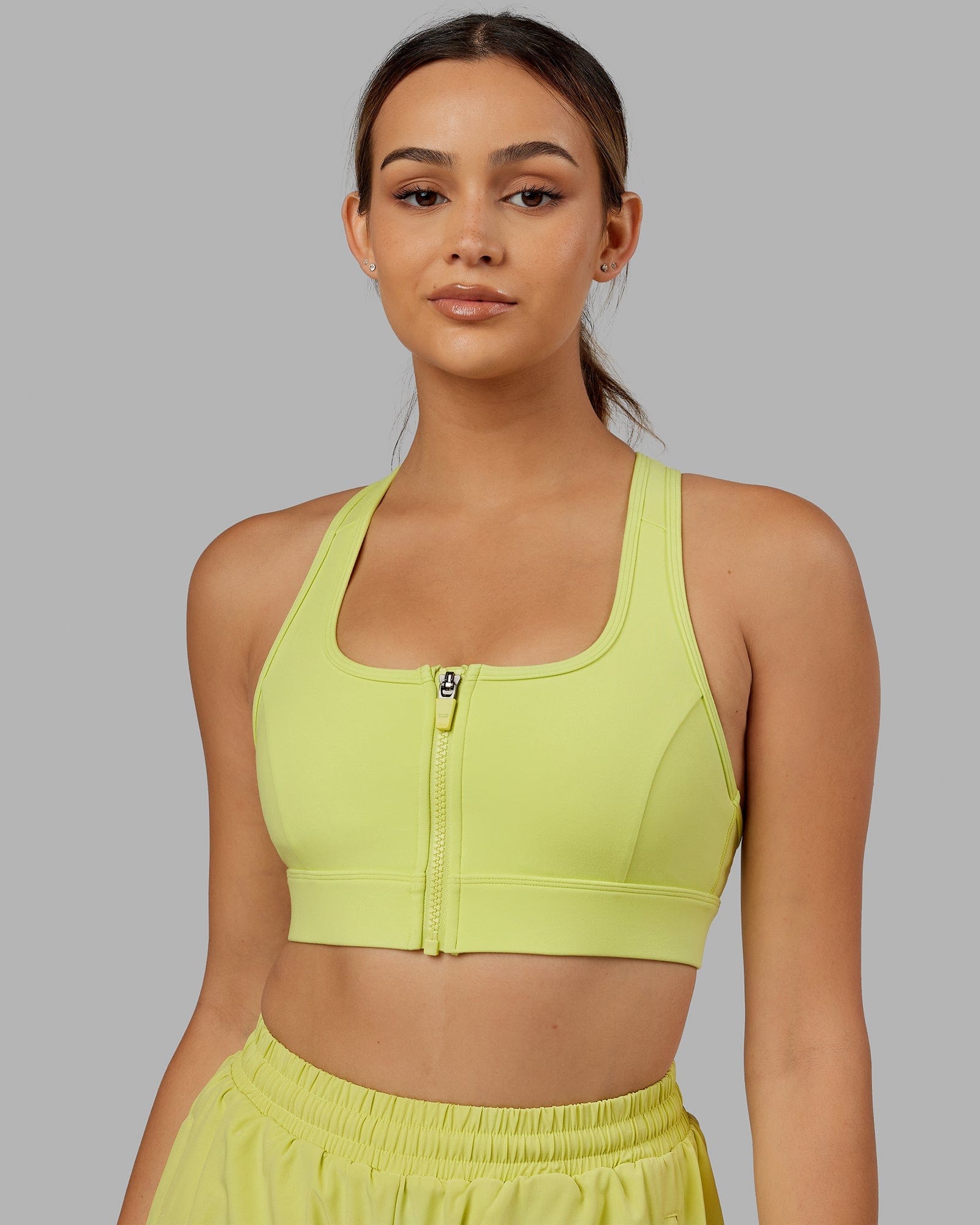 Model wearing Sprint Sports Bra - Citrus Green