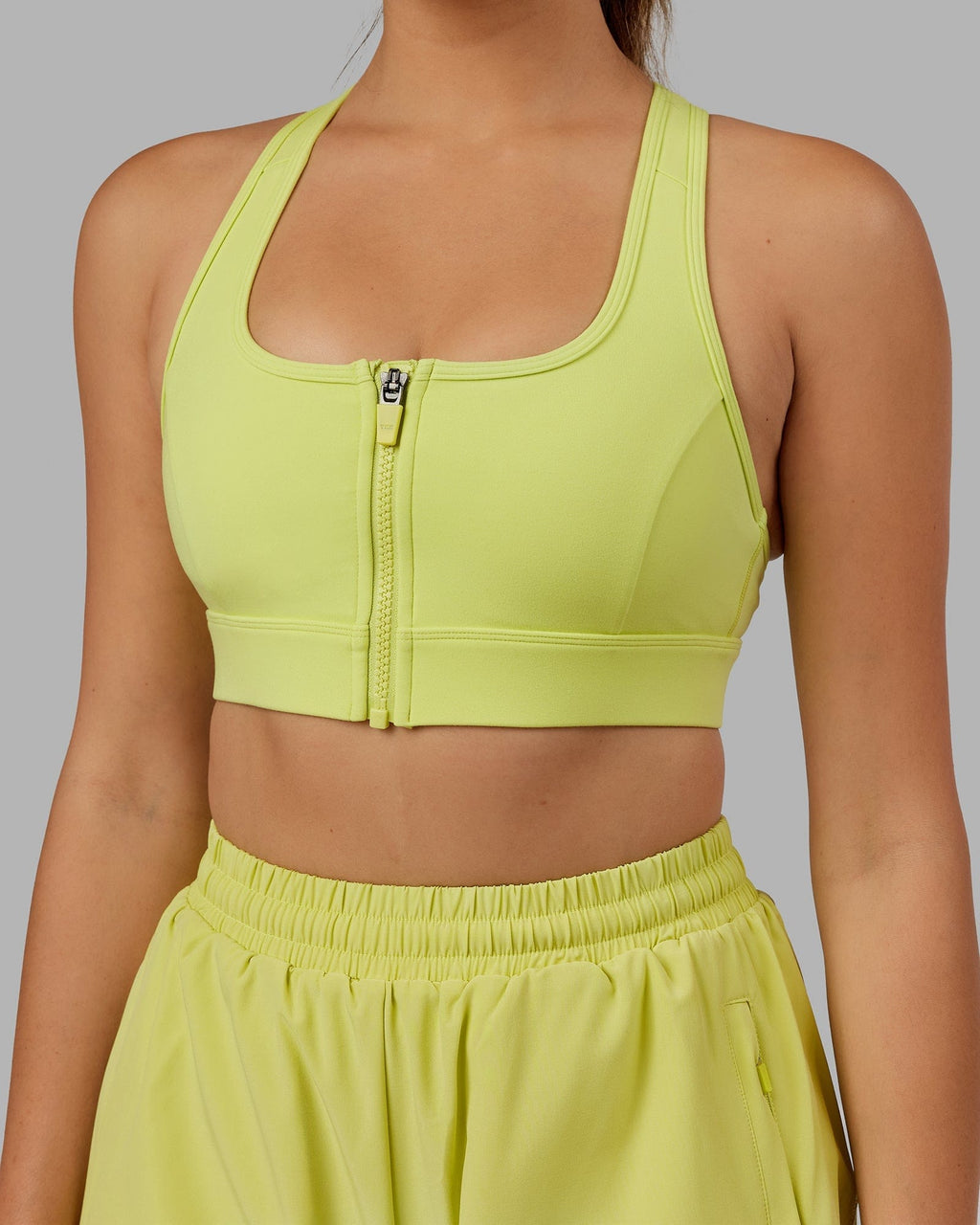 Model wearing Sprint Sports Bra - Citrus Green