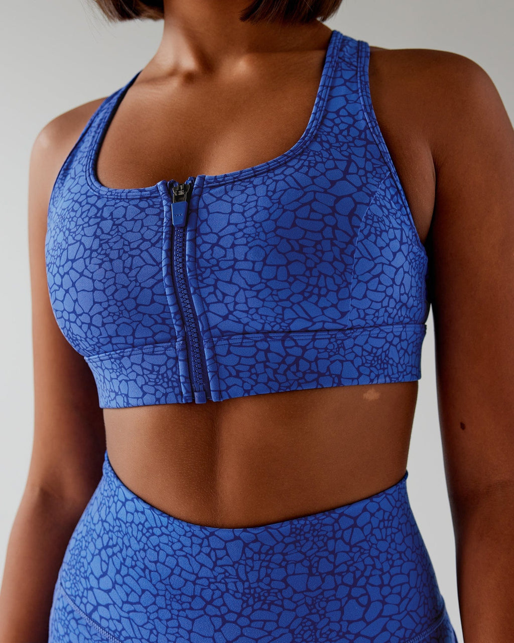 Model wearing Sprint Sports Bra - Ocean Scale