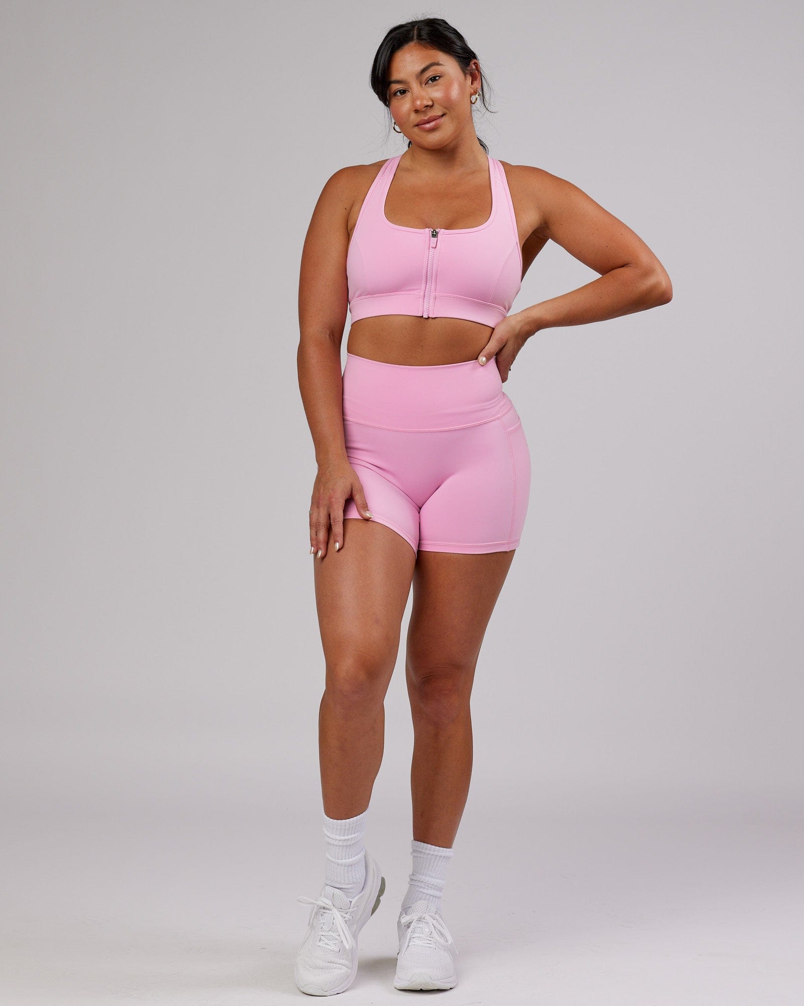 Model wearing Sprint Sports Bra - Pink Frosting