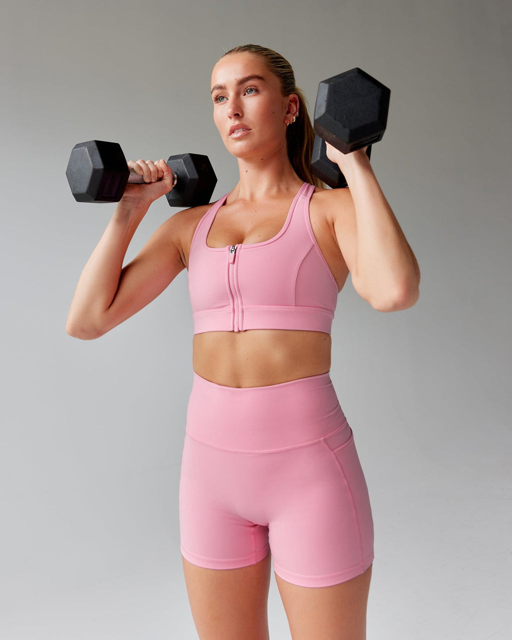 Model wearing Sprint Sports Bra - Pink Frosting