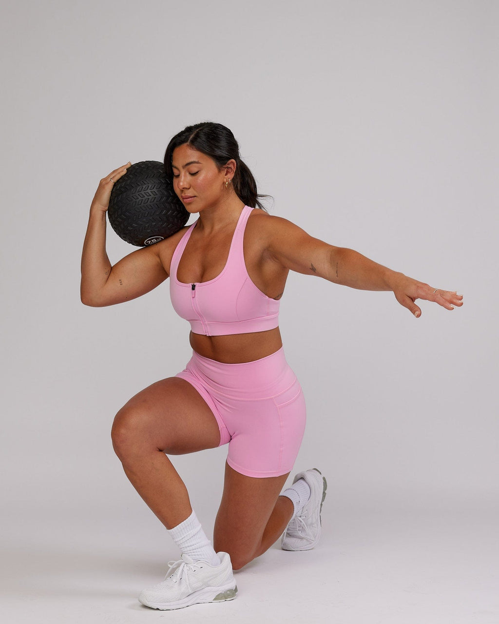 Model wearing Sprint Sports Bra - Pink Frosting