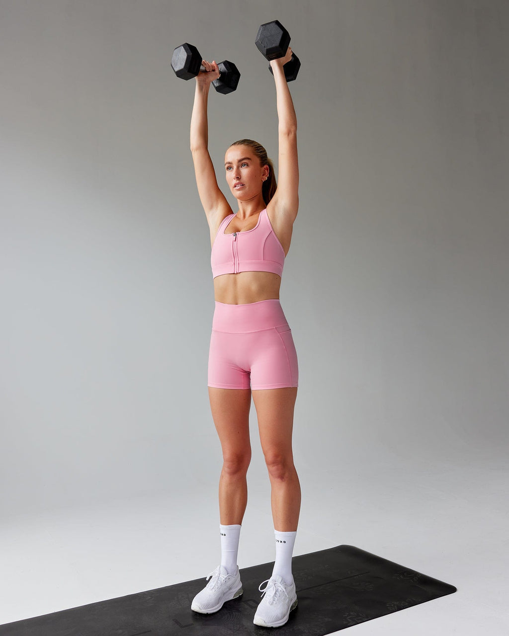 Model wearing Sprint Sports Bra - Pink Frosting