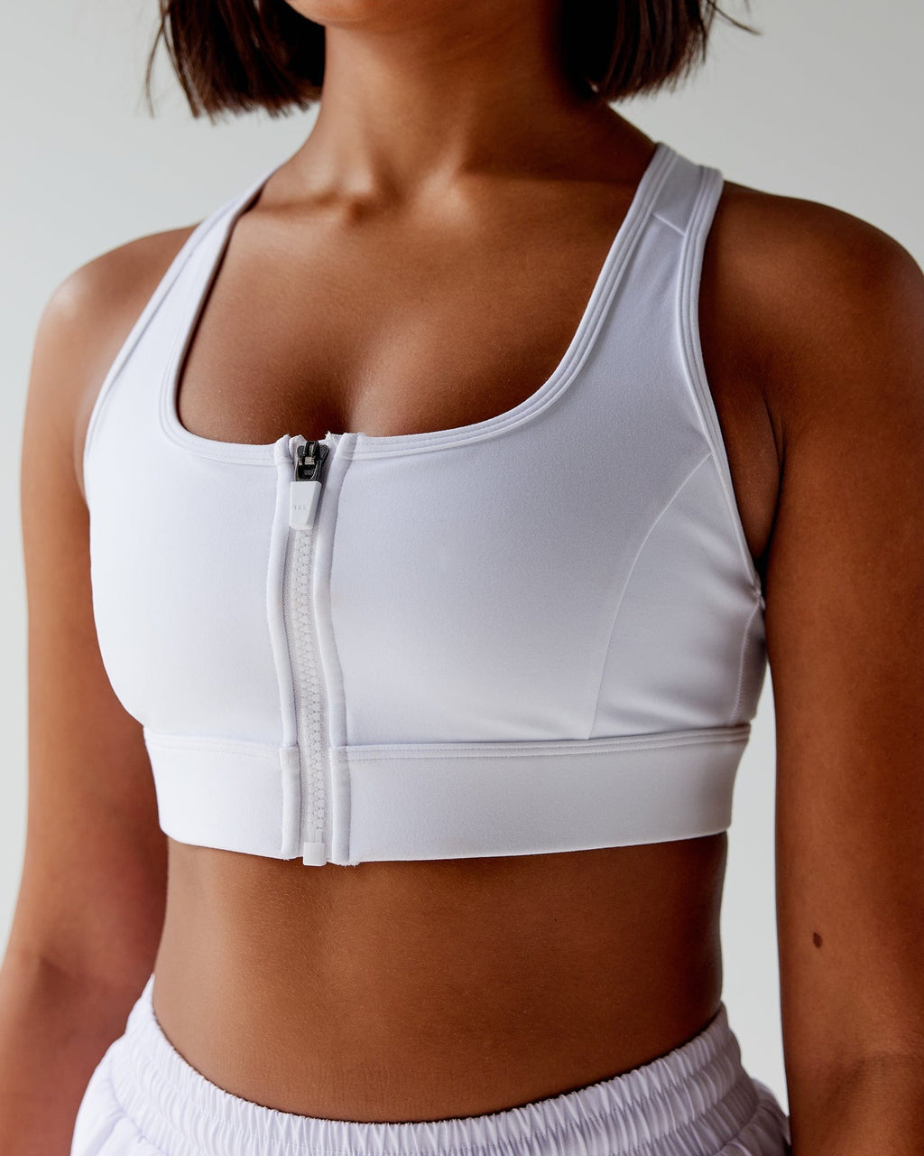 Model wearing Sprint Sports Bra - White