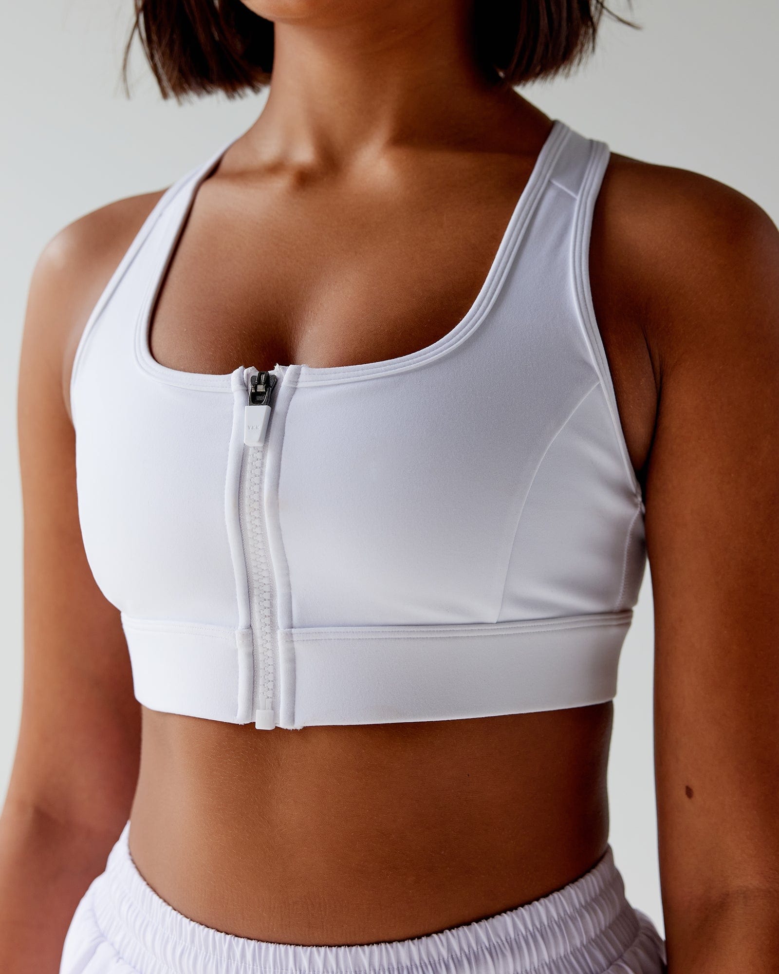 Model wearing Sprint Sports Bra - White