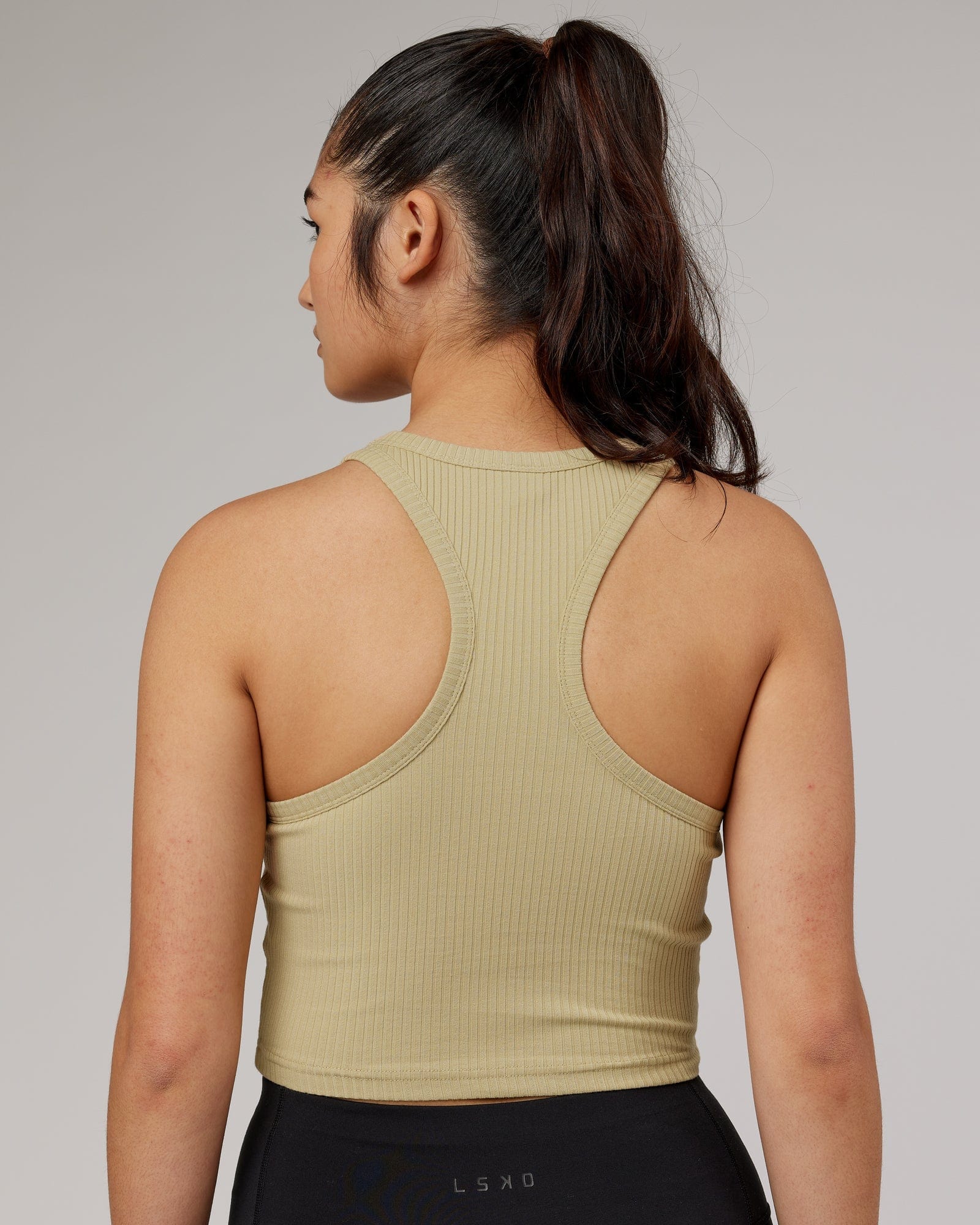 Model wearing Squad Ribbed Tank - Pale Khaki