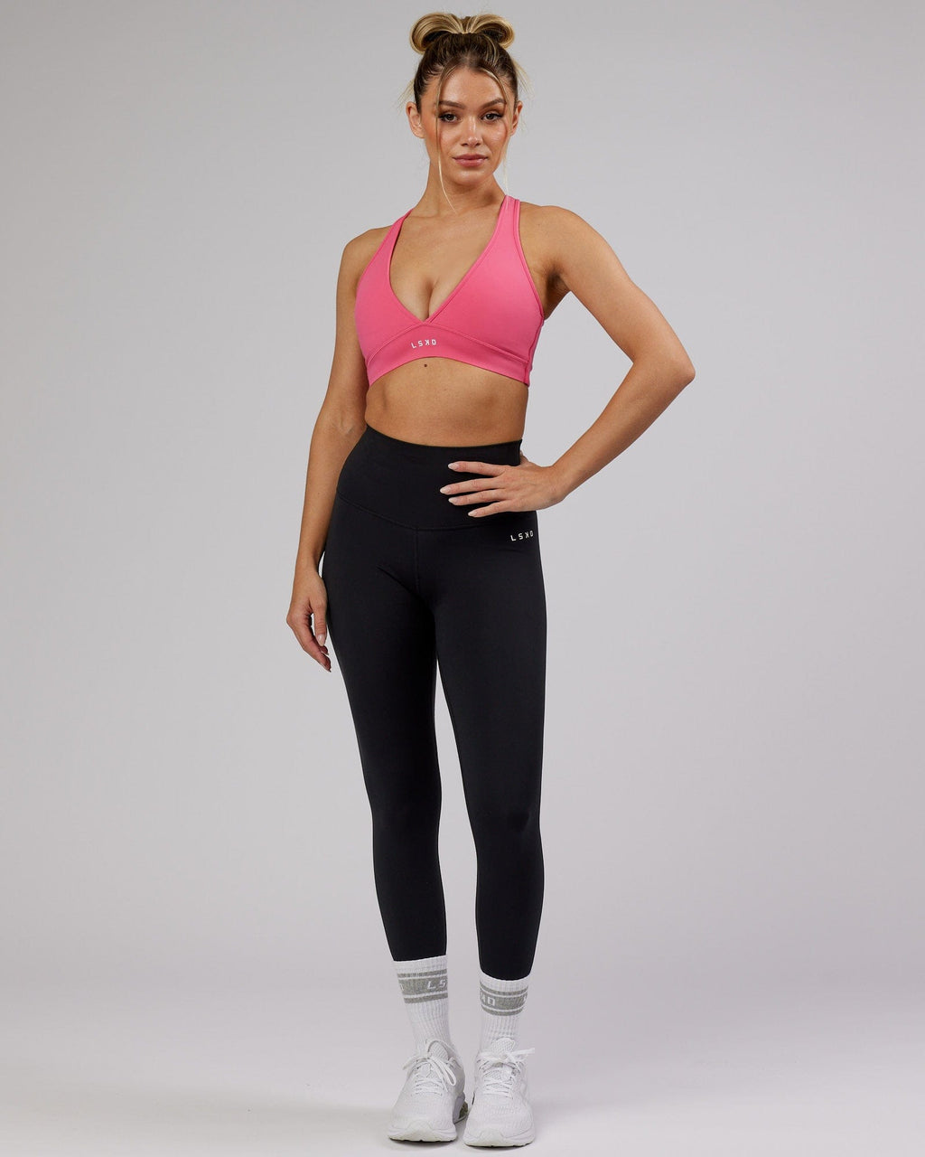 Model wearing Stamina Sports Bra - Flamingo