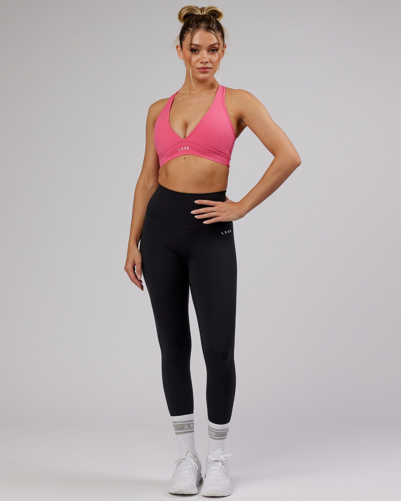 Model wearing Stamina Sports Bra - Flamingo