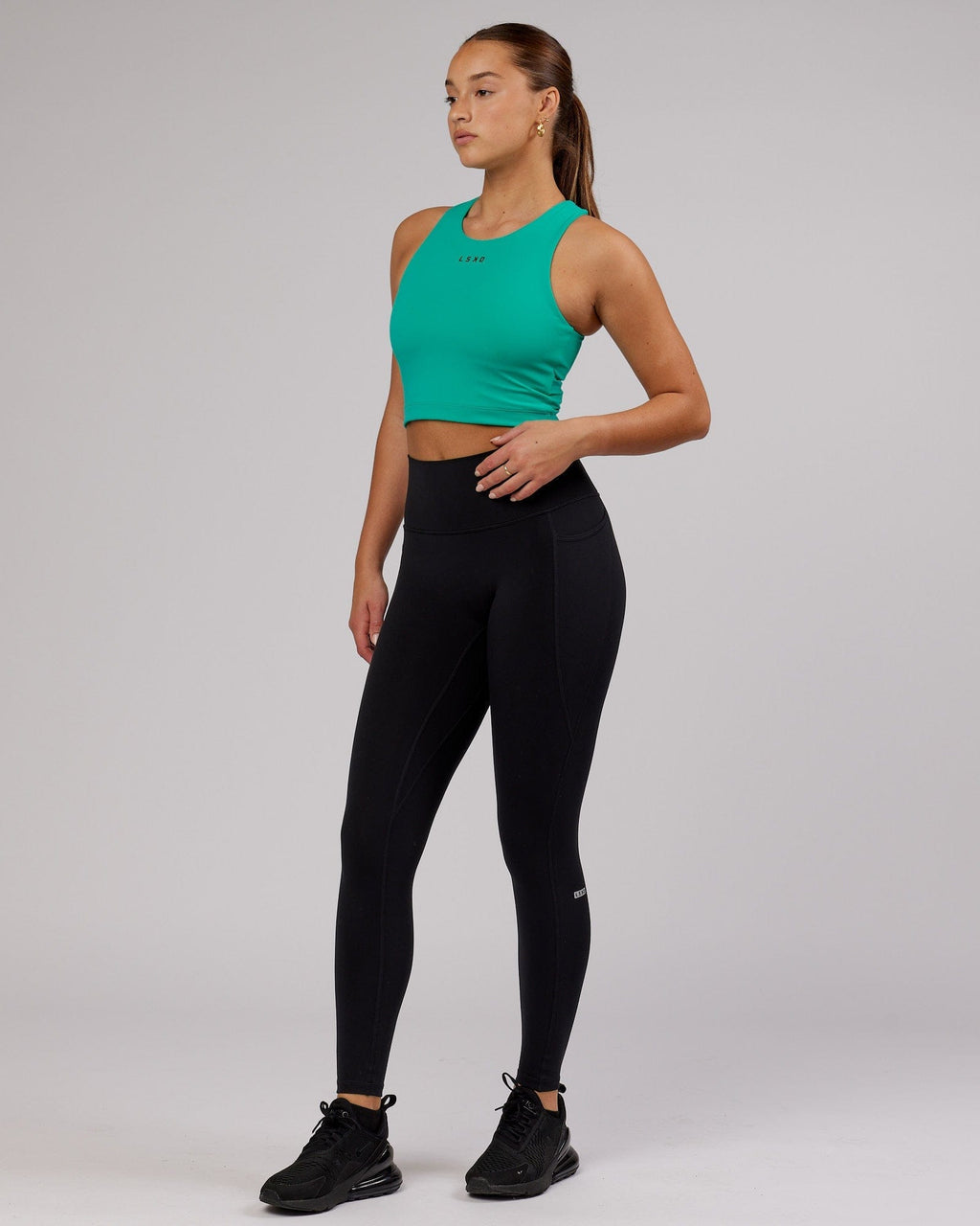 Model wearing Status Shelf Bra Active Tank - Hyper Teal