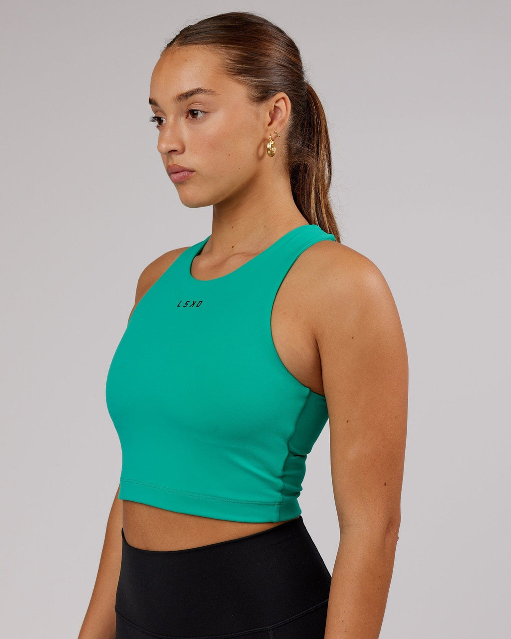 Model wearing Status Shelf Bra Active Tank - Hyper Teal